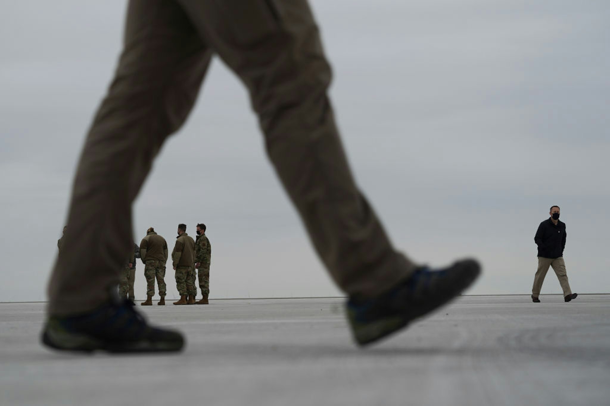 HARLINGEN, TX - JANUARY 12: U.S. Air Force personnel stand guard as Marine Helicopter Squadron One lands at Valley International Airport on January 12, 2021 in Harlingen, Texas. President Donald Trump later delivered remarks during a visit to the U.S.-Mexico Border in Alamo, Texas. (Photo by Go Nakamura/Getty Images)