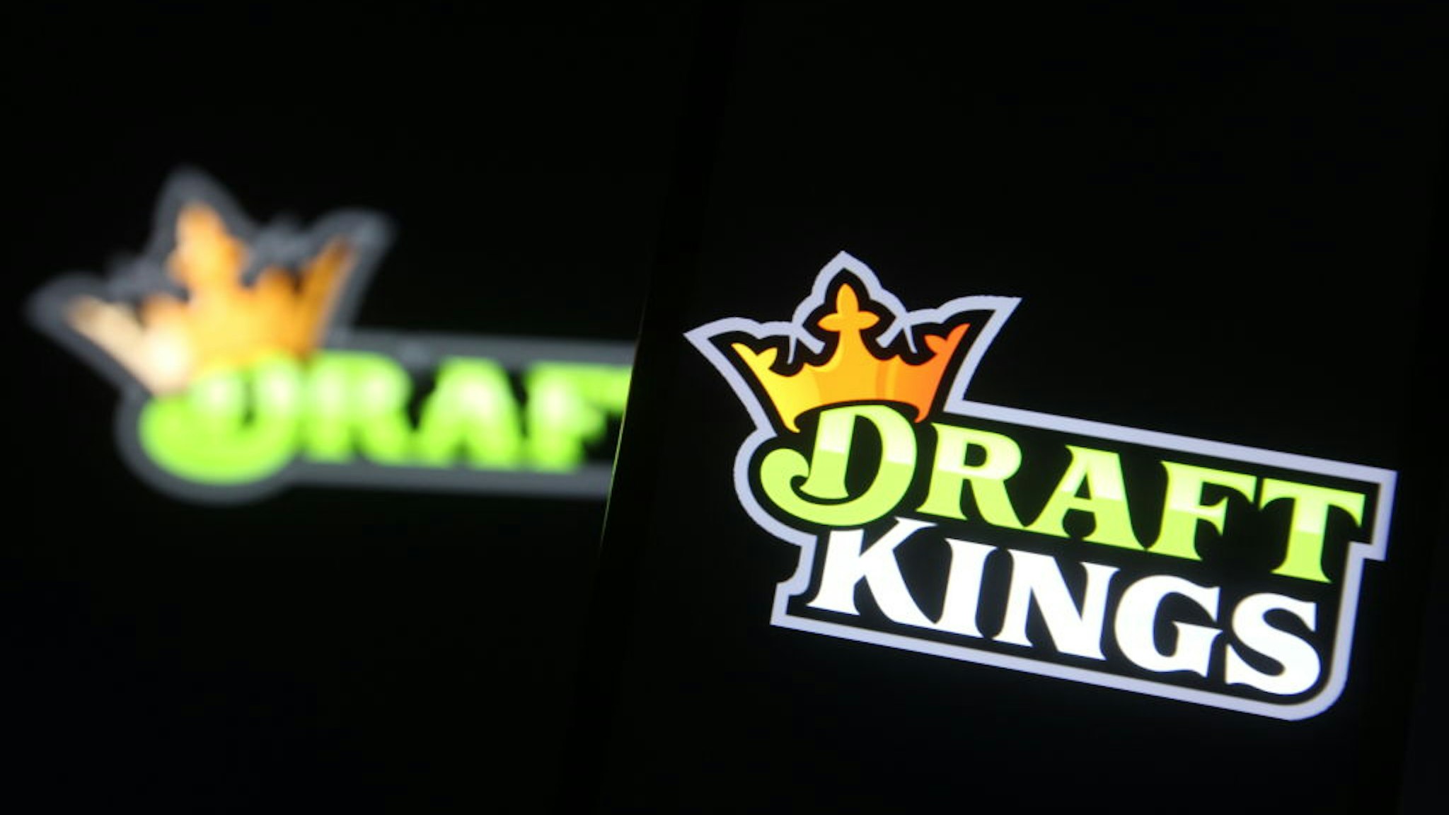 UKRAINE - 2021/02/04: In this photo illustration a DraftKings logo, of the U.S. daily fantasy sports contest and sports betting operator, is seen on a mobile phone screen.