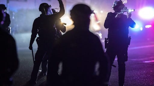 Portland Riots PORTLAND, OR - APRIL 12: Portland police officers search for stragglers after dispersing a riot during a protest against the killing of Daunte Wright on April 12, 2021 in Portland, Oregon. Wright, a Black man whose car was stopped in Brooklyn Center, Minnesota on Sunday reportedly for an expired registration, and not far from where George Floyd was killed during an arrest in Minneapolis last May, was shot and killed by an officer who police say mistook her service revolver for a Taser.