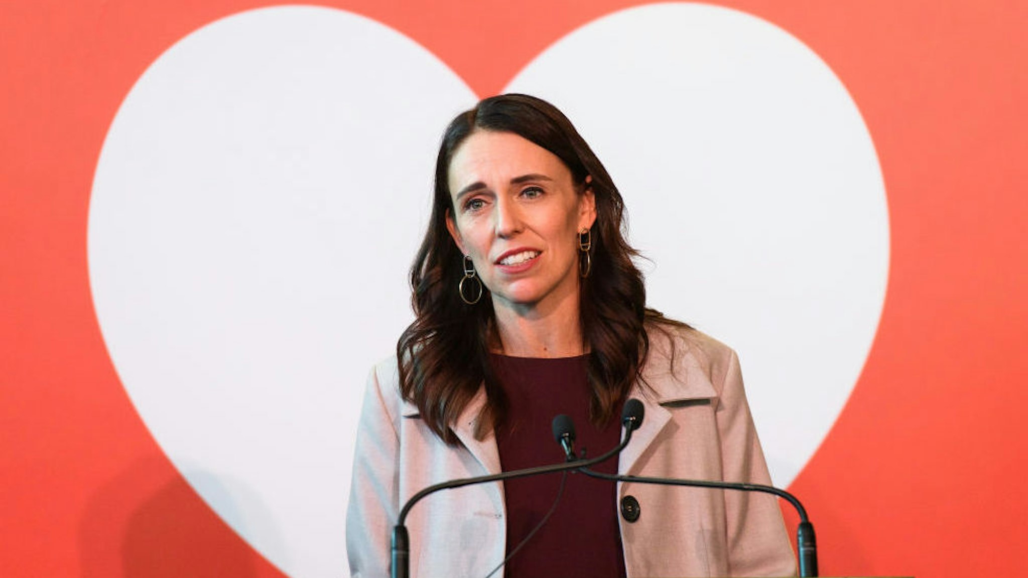 In the handout image provided by Wellington International Airport, New Zealand Prime Minister Jacinda Ardern speaks to the media at the reception for the first Trans-Tasman bubble flight from Australia to Wellington on April 19, 2021 in Wellington, New Zealand.