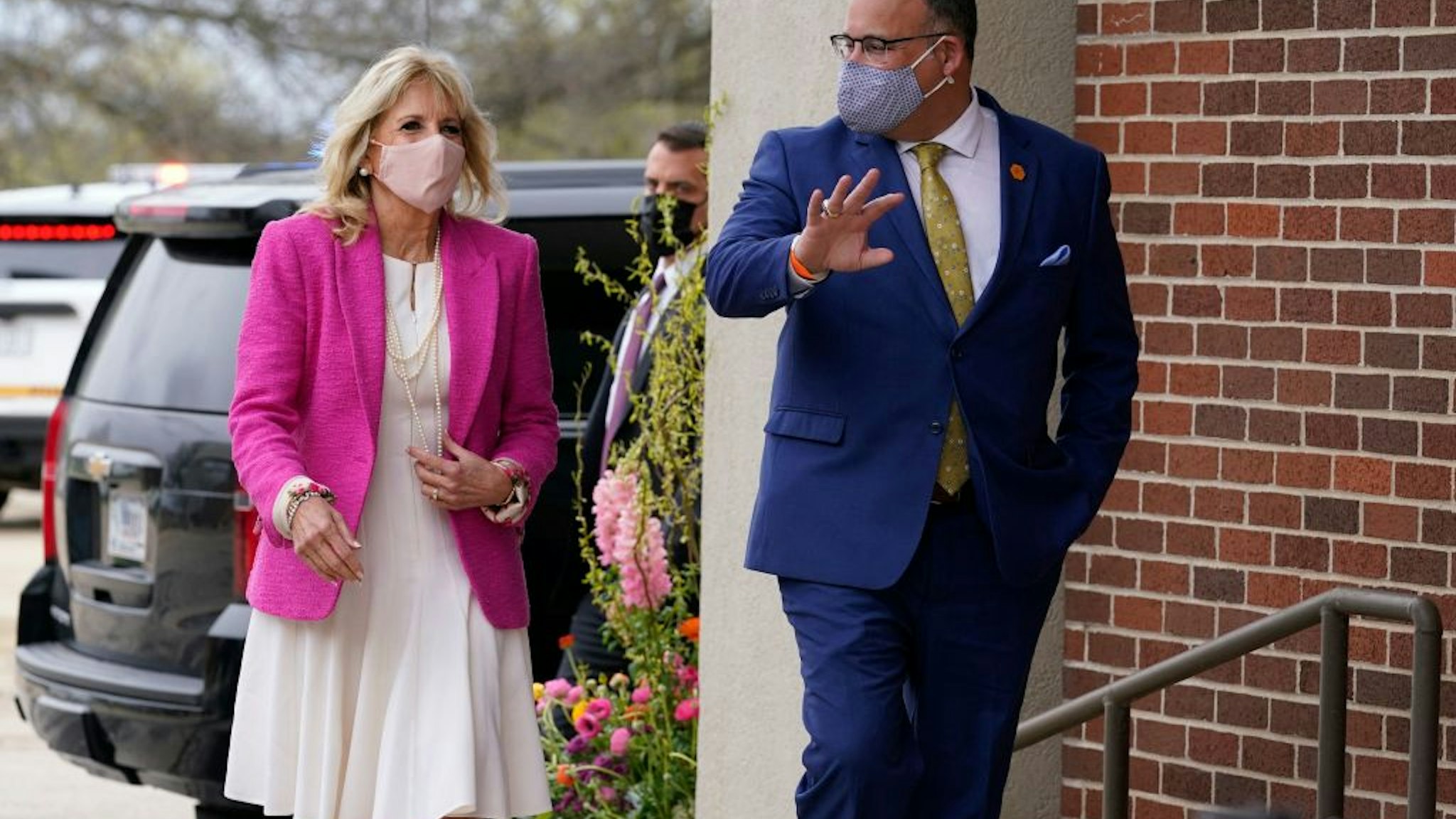 First lady Jill Biden and Education Secretary Miguel Cardona arrive for a visit to the Sauk Valley Community College, in Dixon, Illinois, on April 19, 2021. - Biden and Cardona will be touring the Sauk Valley Community College in Dixon. (Photo by Susan Walsh / POOL / AFP) (Photo by SUSAN WALSH/POOL/AFP via Getty Images)