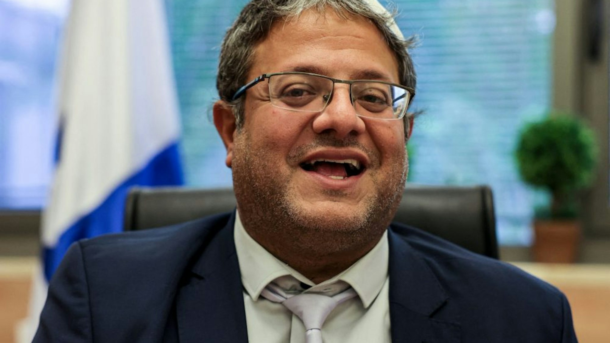 Itamar Ben-Gvir, member of Israel's Knesset (parliament) and head of the one-man far right "Jewish Power" (Otzma Yehudit) party, gives an interview with AFP at his office in the Knesset building in Jerusalem on May 26, 2021. - As Israelis clashed with Palestinians in recent weeks, the hardline nationalist lawmaker allied with embattled Prime Minister Benjamin Netanyahu was repeatedly stoking the flames. The 45-year-old lawyer and father of six, who lives in a settlement near Hebron in the Israel-occupied West Bank, took his seat in the Knesset in April as part of a "Religious Zionism" alliance orchestrated by Netanyahu.