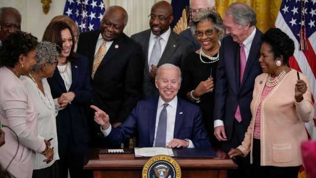 WASHINGTON, DC - JUNE 17: U.S. President Joe Biden signs the Juneteenth National Independence Day Act into law in the East Room of the White House on June 17, 2021 in Washington, DC. The Juneteenth holiday marks the end of slavery in the United States and the Juneteenth National Independence Day will become the 12th legal federal holiday — the first new one since Martin Luther King Jr. Day was signed into law in 1983.