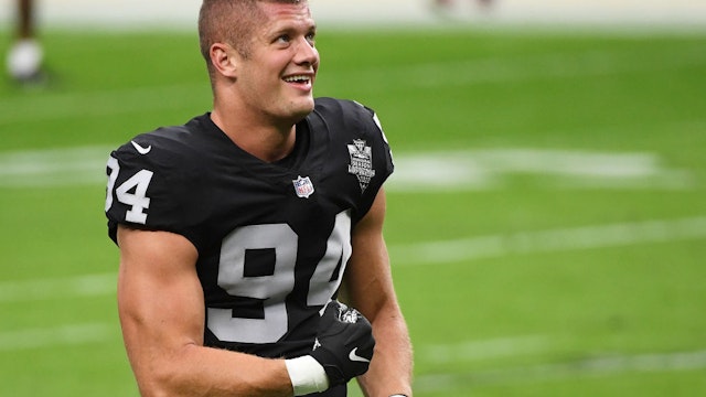 LAS VEGAS, NEVADA - NOVEMBER 15: Carl Nassib #94 of the Las Vegas Raiders flexes while smiling during warmups before a game against the Denver Broncos at Allegiant Stadium on November 15, 2020 in Las Vegas, Nevada. (Photo by Ethan Miller/Getty Images)