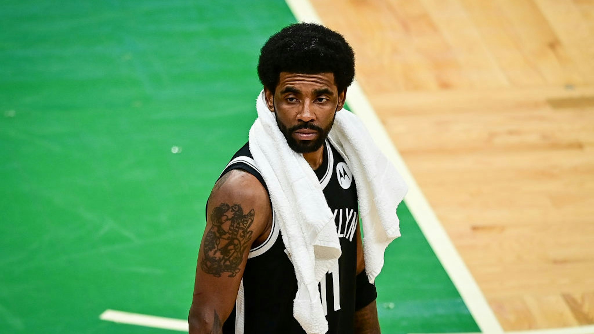 BOSTON, MASSACHUSETTS - MAY 30: Kyrie Irving #11 of the Brooklyn Nets looks on during Game Four of the Eastern Conference first round series against the Boston Celtics at TD Garden on May 30, 2021 in Boston, Massachusetts. NOTE TO USER: User expressly acknowledges and agrees that, by downloading and or using this photograph, User is consenting to the terms and conditions of the Getty Images License Agreement. (Photo by Maddie Malhotra/Getty Images)
