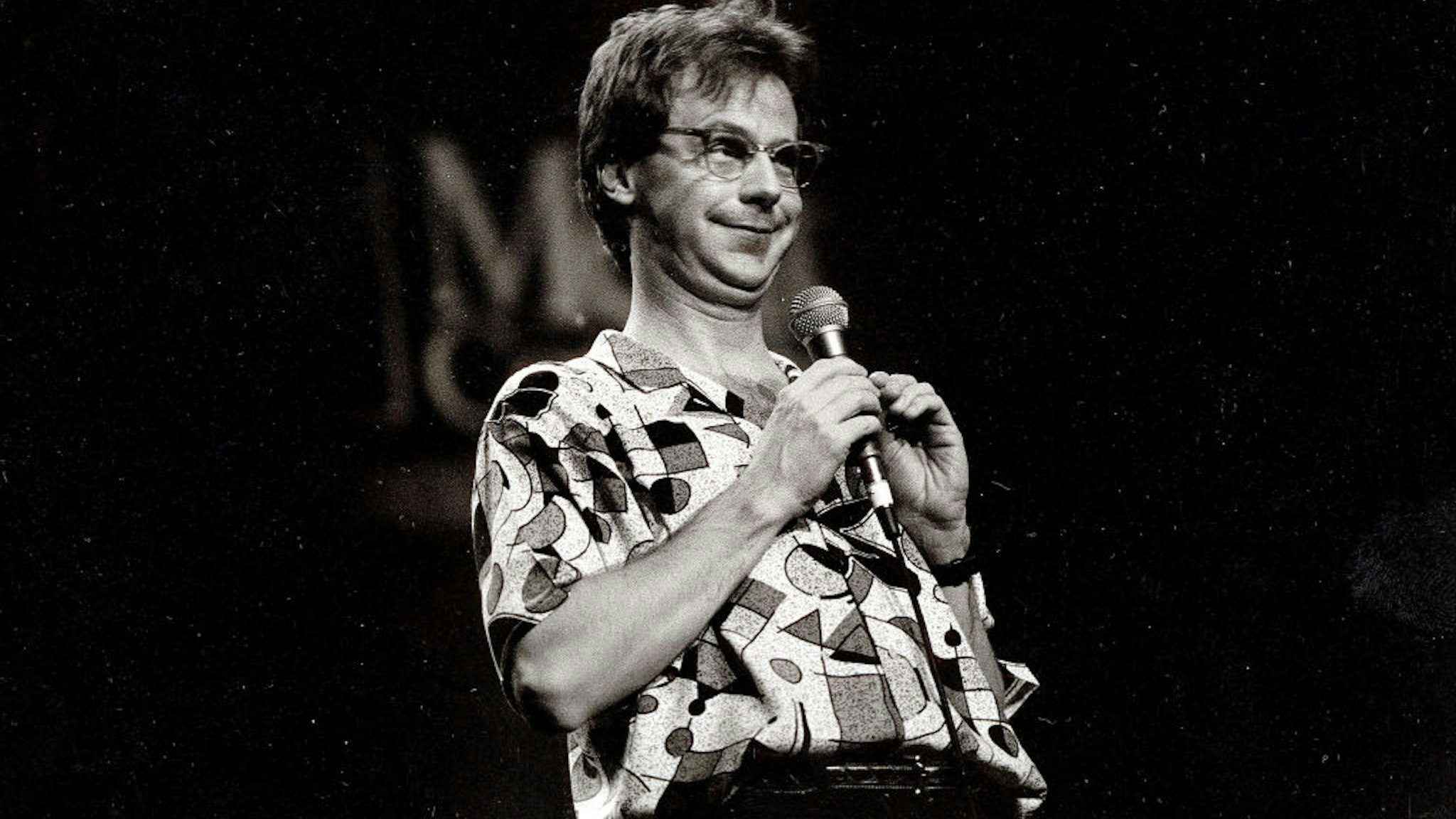 View of comedian Dana Carvey performing onstage, Chicago, Illinois, November 4, 1990. (Photo by Paul Natkin/Getty Images)