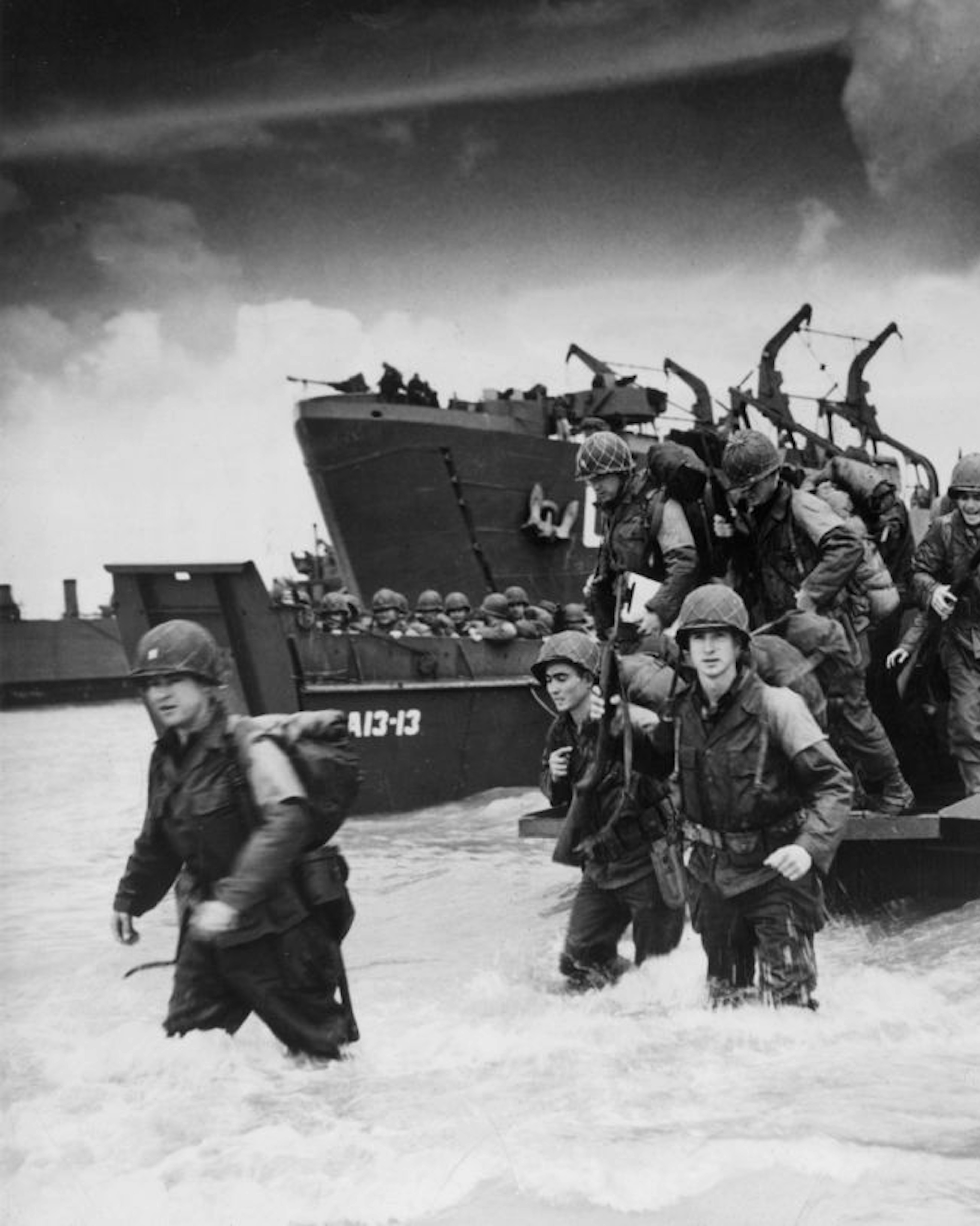6th June 1944: Reinforcements disembarking from a landing barge at Normandy during the Allied Invasion of France on D-Day. (Photo by Hulton Archive/Getty Images)