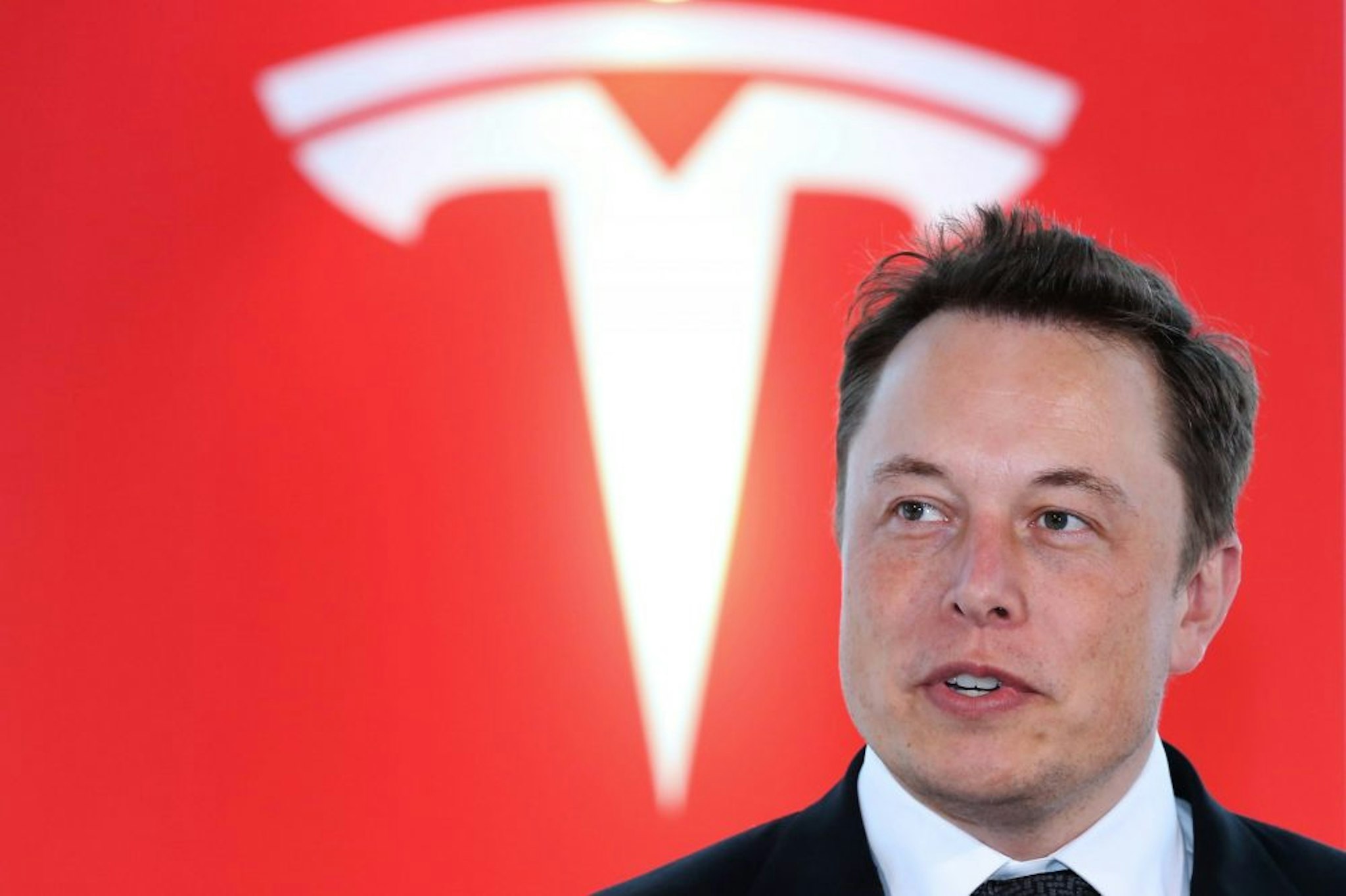 Elon Musk, co-founder and chief executive officer of Tesla Motors Inc., attends a key delivery ceremony of the company's premium electric sedan Model S vehicles to customers in Tokyo, Japan, on Monday, Sept. 8, 2014. Tesla may partner with Toyota Motor Corp. again in the future, Musk said.