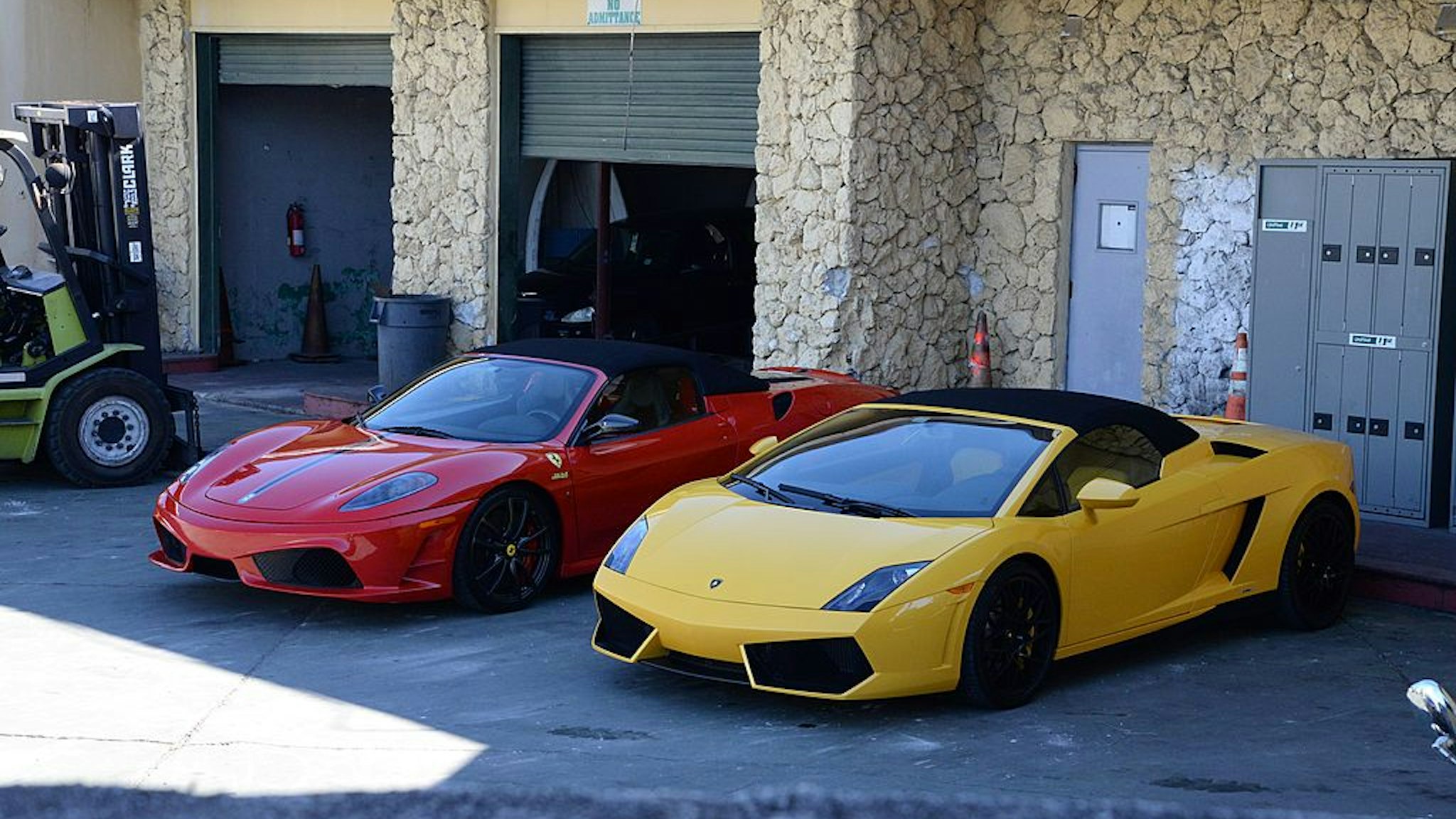 MIAMI BEACH, FL - JANUARY 23: Ferrari and Lamborghini cars believed to have been used by Justin Bieber during his road racing before he was arrested sit in an impound lot on January 23, 2014 in Miami Beach, Florida. Justin Bieber was charged with drunken driving, resisting arrest and driving without a valid license after Miami Beach Police found the pop star street racing on Thursday morning. (Photo by Manny Hernandez/Getty Images)