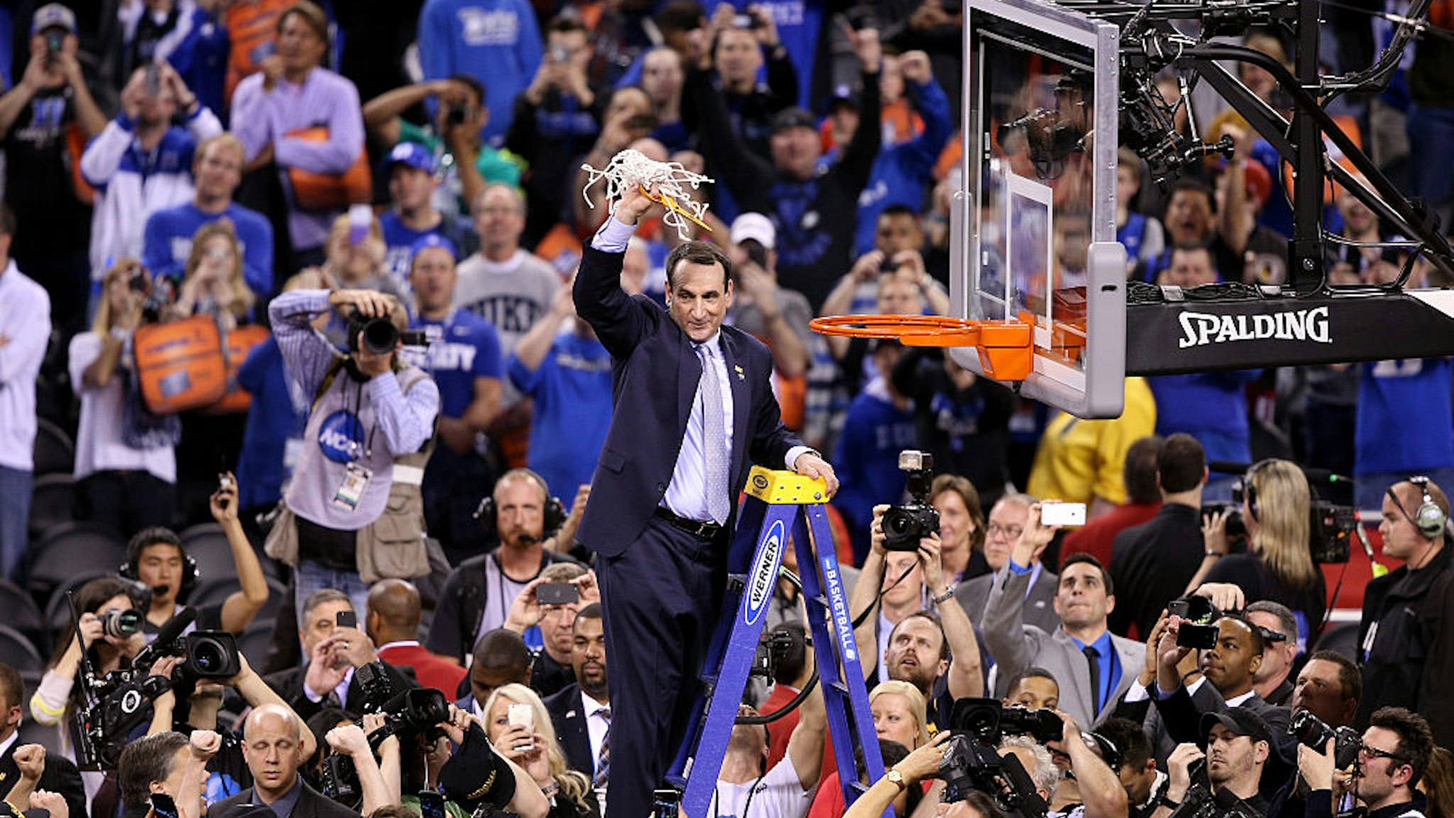 INDIANAPOLIS, IN - APRIL 06: Head coach Mike Krzyzewski of the Duke Blue Devils cuts down the net after defeating the Wisconsin Badgers during the NCAA Men's Final Four National Championship at Lucas Oil Stadium on April 6, 2015 in Indianapolis, Indiana. Duke defeated Wisconsin 68-63. (Photo by Joe Robbins/Getty Images)