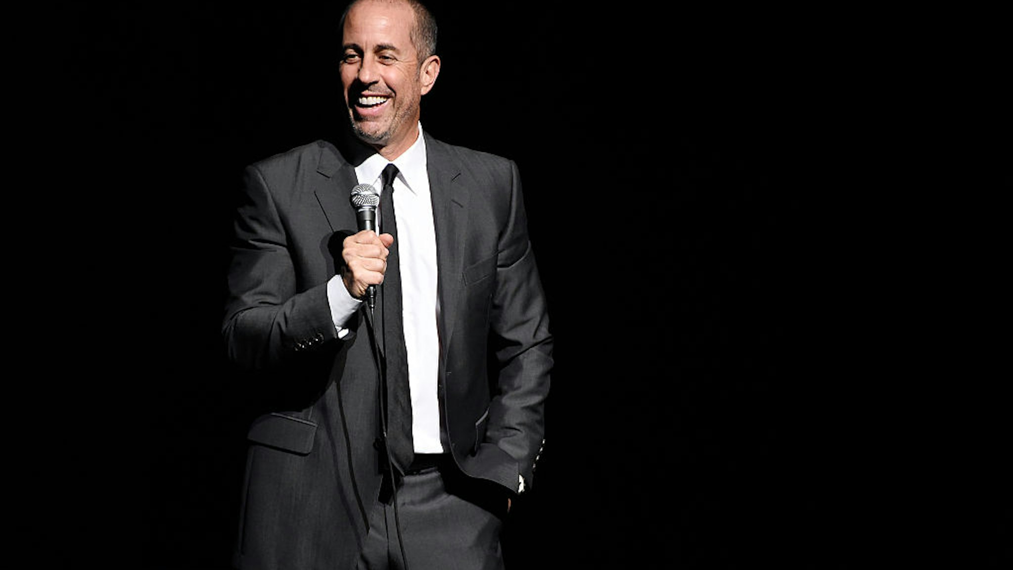 NEW YORK, NY - NOVEMBER 16: Comedian Jerry Seinfeld performs onstage as Baby Buggy celebrates 15 years with "An Evening with Jerry Seinfeld and Amy Schumer" presented by Bank of America - Inside at Beacon Theatre on November 16, 2015 in New York City. (Photo by Kevin Mazur/Getty Images for Baby Buggy)