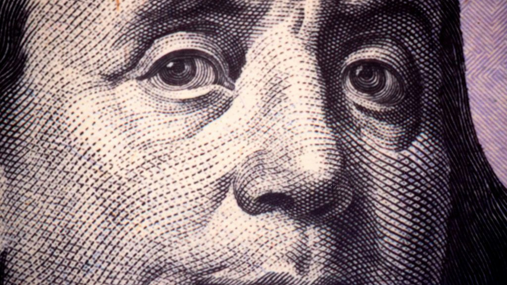 A close up photo of Benjamin Franklin, one of the founding fathers of the United States, as seen on a US $100 Federal Reserve Note November 17, 2015 at the Department of the Treasury, Bureau of Engraving and Printing in Washington, DC. AFP PHOTO/PAUL J. RICHARDS (Photo by Paul J. RICHARDS / AFP) (Photo by PAUL J. RICHARDS/AFP via Getty Images)