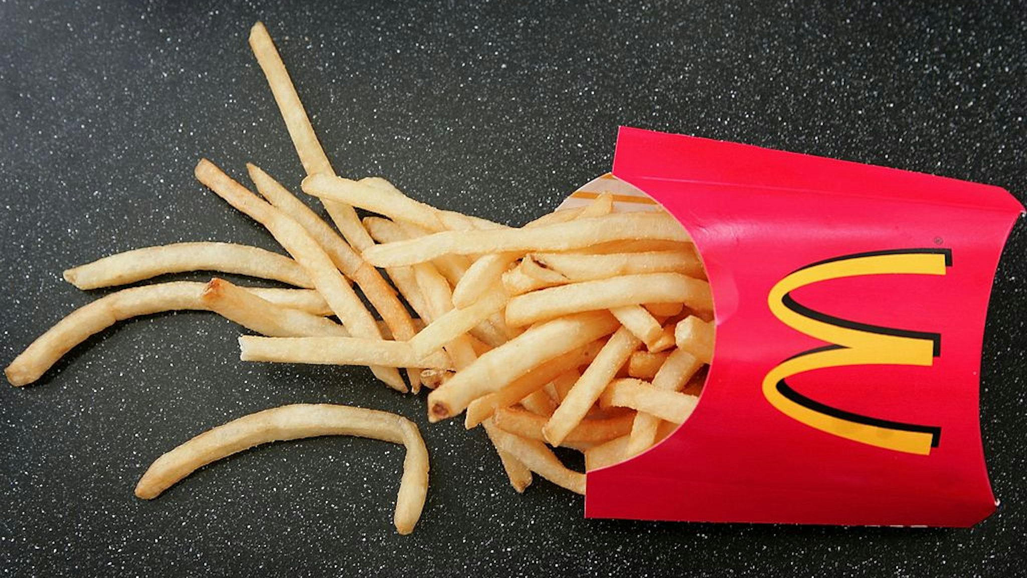 DES PLAINES, IL - FEBRUARY 15: French fries sit on a table at a McDonald's restaurant February 15, 2006 in Des Plaines, Illinois. McDonald's announced February 13 that their french fries contain potential allergens from both wheat and dairy ingredients used to add flavor. (Photo Illustration by Scott Olson/Getty Images)