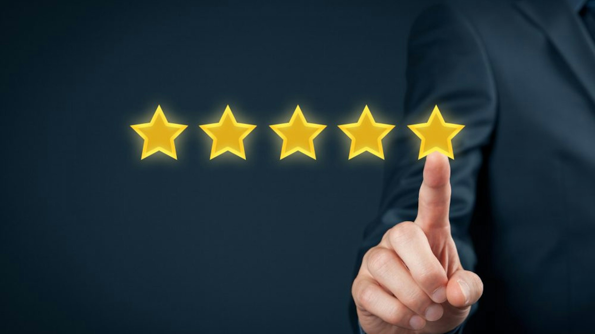 Review, increase rating or ranking, evaluation and classification concept. Businessman click on five yellow stars to increase rating of his company."