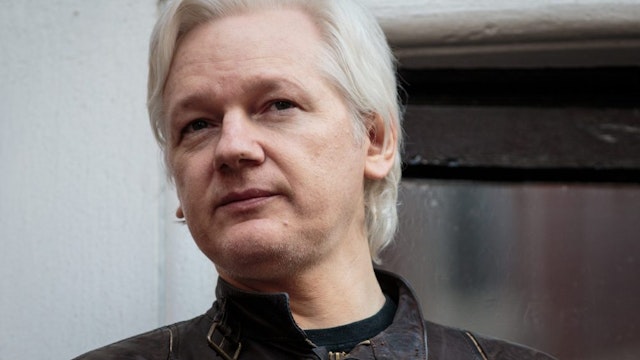 LONDON, ENGLAND - MAY 19: Julian Assange speaks to the media from the balcony of the Embassy Of Ecuador on May 19, 2017 in London, England. Julian Assange, founder of the Wikileaks website that published US Government secrets, has been wanted in Sweden on charges of rape since 2012. He sought asylum in the Ecuadorian Embassy in London and today police have said he will still face arrest if he leaves.