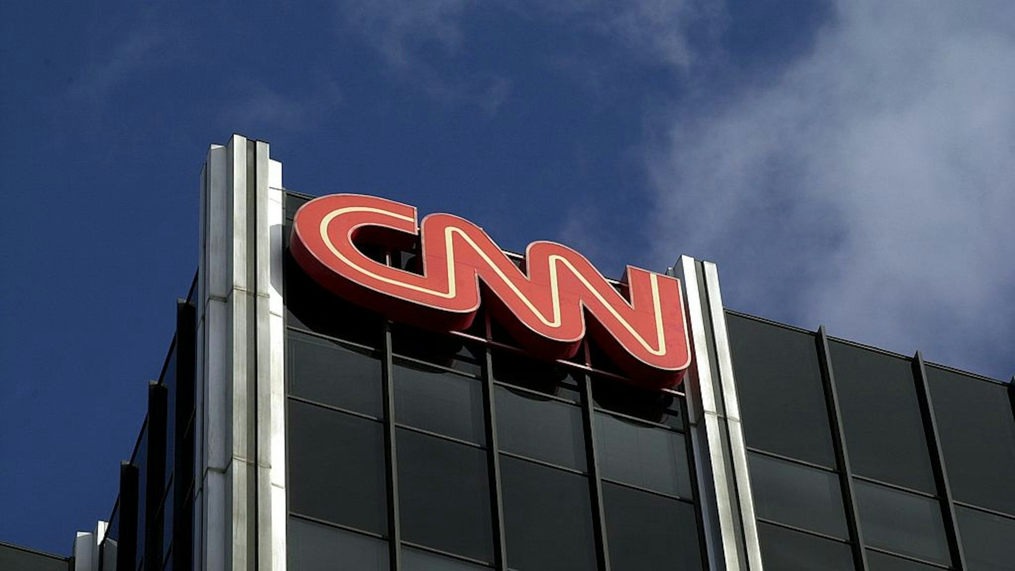384757 02: The Cable News Network (CNN) logo adorns the top of CNN's offices on the Sunset Strip, January 24, 2000 in Hollywood, CA. CNN was hit with job cuts earlier this week after CNN's parent company, Time-Warner, Inc., completed its merger with America Online, Inc. (Photo by David McNew/Newsmakers)
