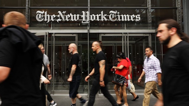 NEW YORK, NY - JULY 27: People walk past the New York Times building on July 27, 2017 in New York City. The New York Times Company shares have surged to a nine-year high after posting strong earnings on Thursday. Partly due to new digital subscriptions following the election of Donald Trump as president, the company reported a profit of $27.7 million in the second quarter, up from $9.1 million in the same period last year.