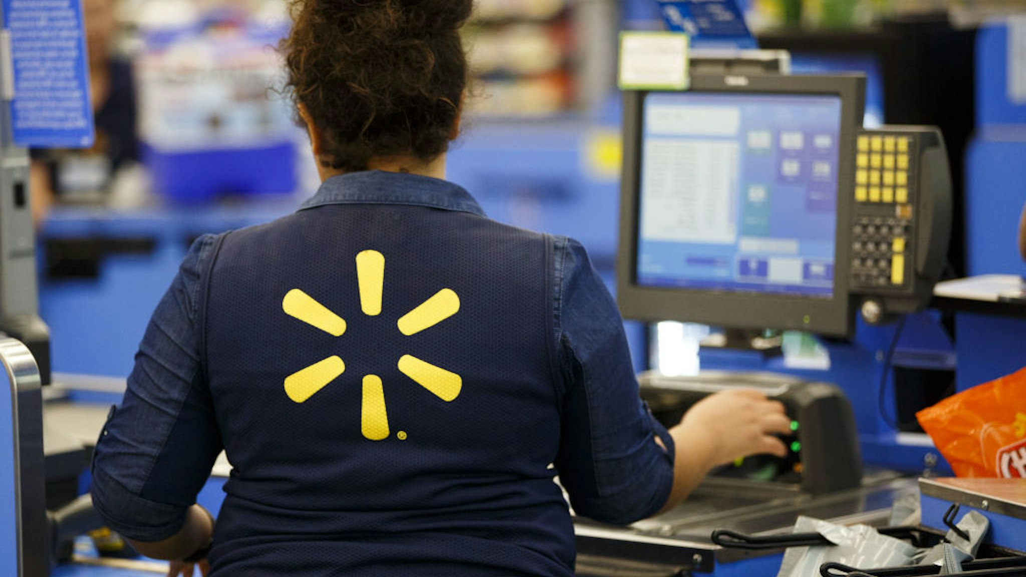 An employee scans items at a cash register at a Wal-Mart Stores Inc. location in Burbank, California, U.S., on Tuesday, Aug. 8, 2017. Wal-Mart Stores is scheduled to release earnings figures on August 17. Photographer: Patrick T. Fallon/Bloomberg via Getty ImagesAn employee scans items at a cash register at a Wal-Mart Stores Inc. location in Burbank, California, U.S., on Tuesday, Aug. 8, 2017. Wal-Mart Stores is scheduled to release earnings figures on August 17. Photographer: Patrick T. Fallon/Bloomberg via Getty Images