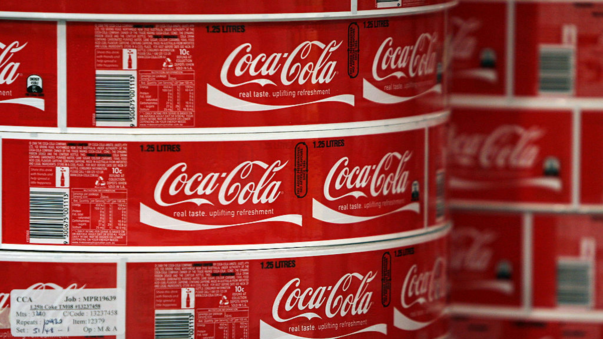 AUSTRALIA - APRIL 30: Labels for bottles of Coca-Cola soft-drink are stacked at the Coca-Cola Amatil Ltd. bottling plant in Sydney, Australia, on Thursday, April 30, 2009. Coca- Cola Amatil Ltd. is Australia's biggest soft-drink maker. (Photo by Ian Waldie/Bloomberg via Getty Images)
