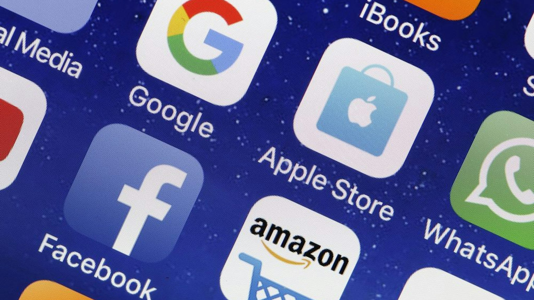PARIS, FRANCE - MAY 31: In this photo illustration, logos of the Google, Apple, Facebook, and Amazon applications (GAFA) are displayed on the screen of an Apple iPhone on May 31, 2018 in Paris, France. The acronym GAFA refers to the four most powerful companies in the world of the internet: Google, Apple, Facebook and Amazon. The European Union has decided to better tax the giants of the internet with Brussels proposing to tax 3% of income generated by the data of users of Internet companies. This new tax would bring in 5 billion euros a year in the European Union.