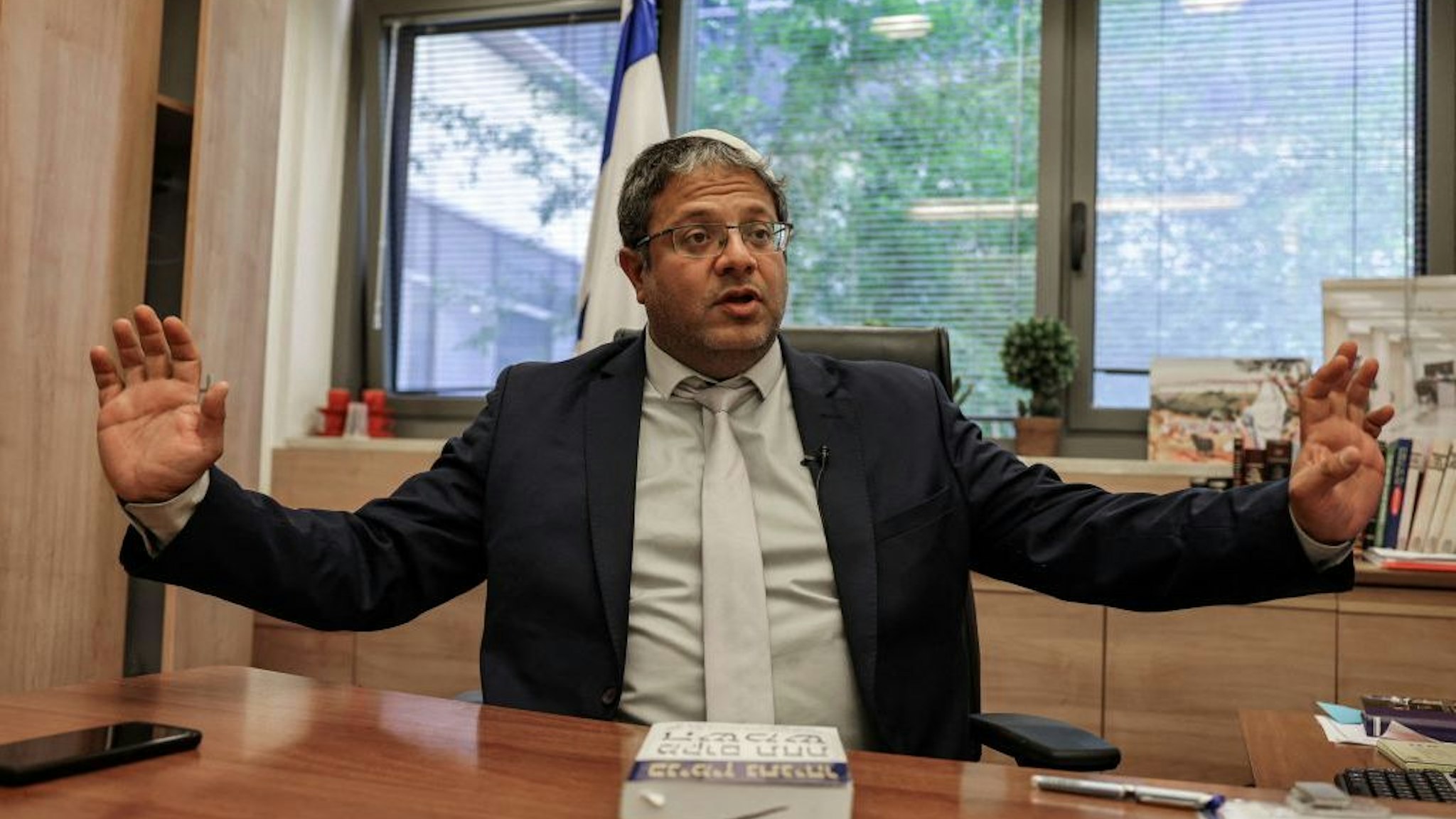 Itamar Ben-Gvir, member of Israel's Knesset (parliament) and head of the one-man far right "Jewish Power" (Otzma Yehudit) party, gives an interview with AFP at his office in the Knesset building in Jerusalem on May 26, 2021. - As Israelis clashed with Palestinians in recent weeks, the hardline nationalist lawmaker allied with embattled Prime Minister Benjamin Netanyahu was repeatedly stoking the flames. The 45-year-old lawyer and father of six, who lives in a settlement near Hebron in the Israel-occupied West Bank, took his seat in the Knesset in April as part of a "Religious Zionism" alliance orchestrated by Netanyahu. (Photo by Menahem KAHANA / AFP) (Photo by MENAHEM KAHANA/AFP via Getty Images)