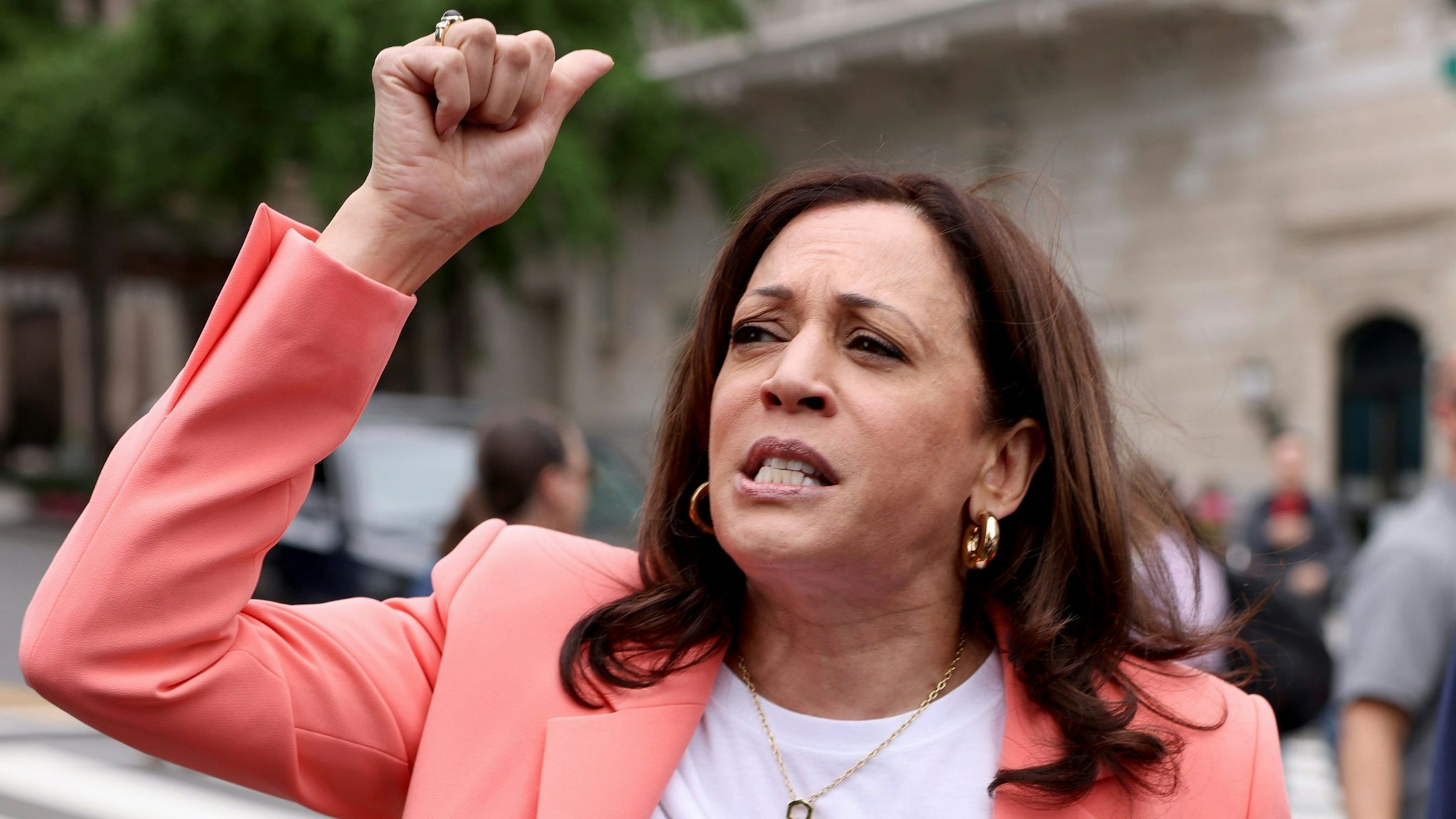 WASHINGTON, DC - JUNE 12: U.S. Vice President Kamala Harris speaks to marchers, as her husband Doug Emhoff looks on, during the Capitol Pride Parade on June 12, 2021 in Washington, DC. Capital Pride returned to Washington DC, after being canceled last year due to the Covid-19 pandemic.