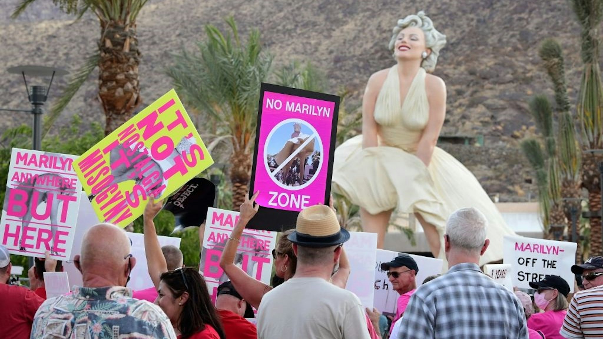 Protesters gather in front of the "Forever Marilyn" statue unveiled today on its return to Palm Springs, California on June 20, 2021.