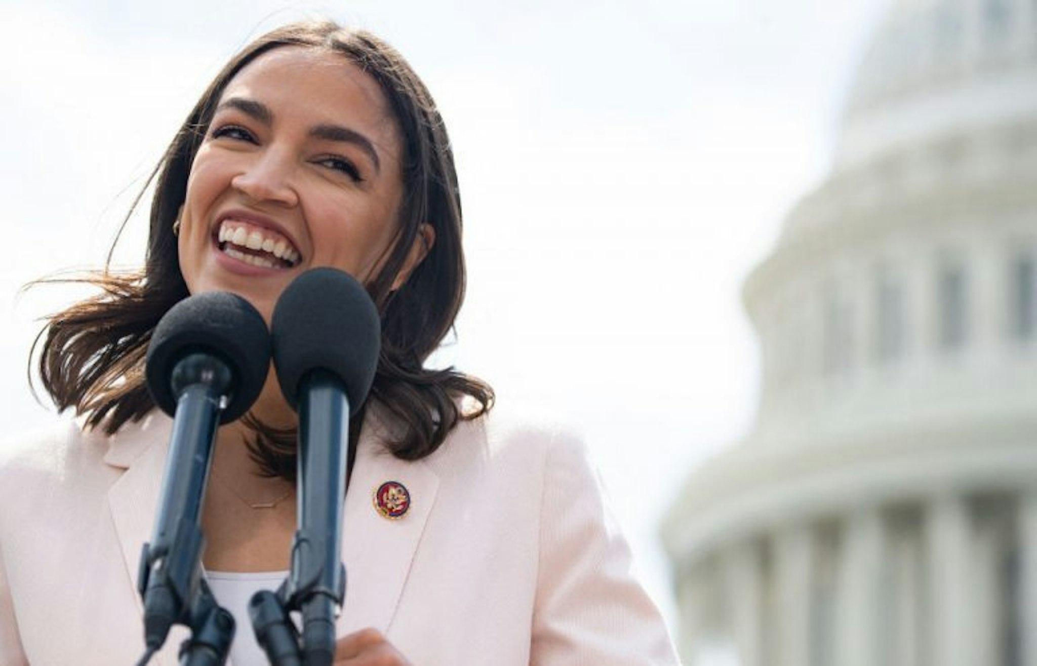 US Representative Alexandria Ocasio-Cortez, Democrat of New York, attends a press conference about a postal banking pilot program outside the US Capitol in Washington, DC, April 15, 2021. (SAUL LOEB/AFP via Getty Images)