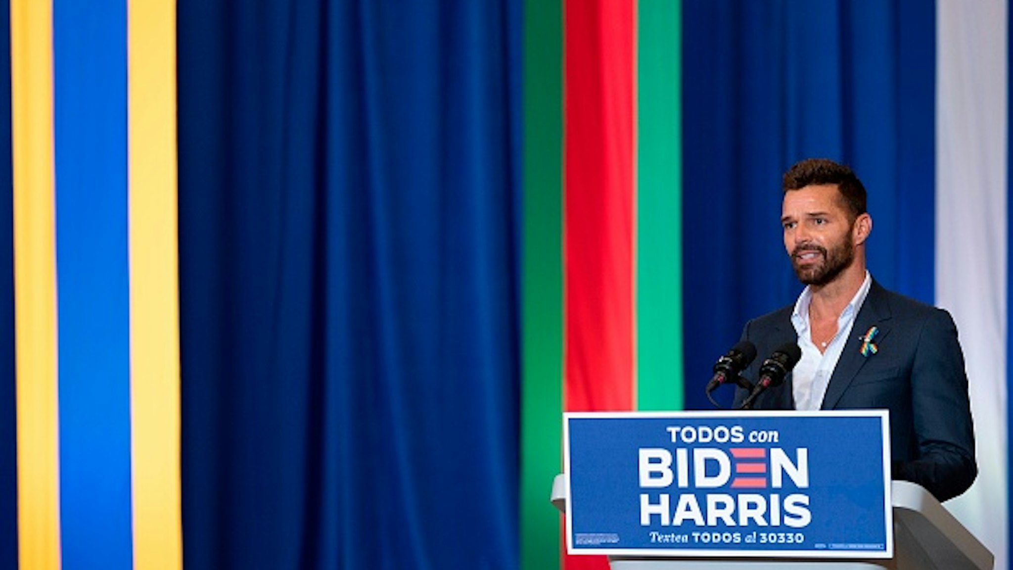 Ricky Martin, a Puerto Rican singer, songwriter, and humanitarian, speaks before Democratic Presidential Candidate Joe Biden as they participate in a Hispanic Heritage Month event at the Osceola Heritage Park in Kissimmee, Florida on September 15, 2020.