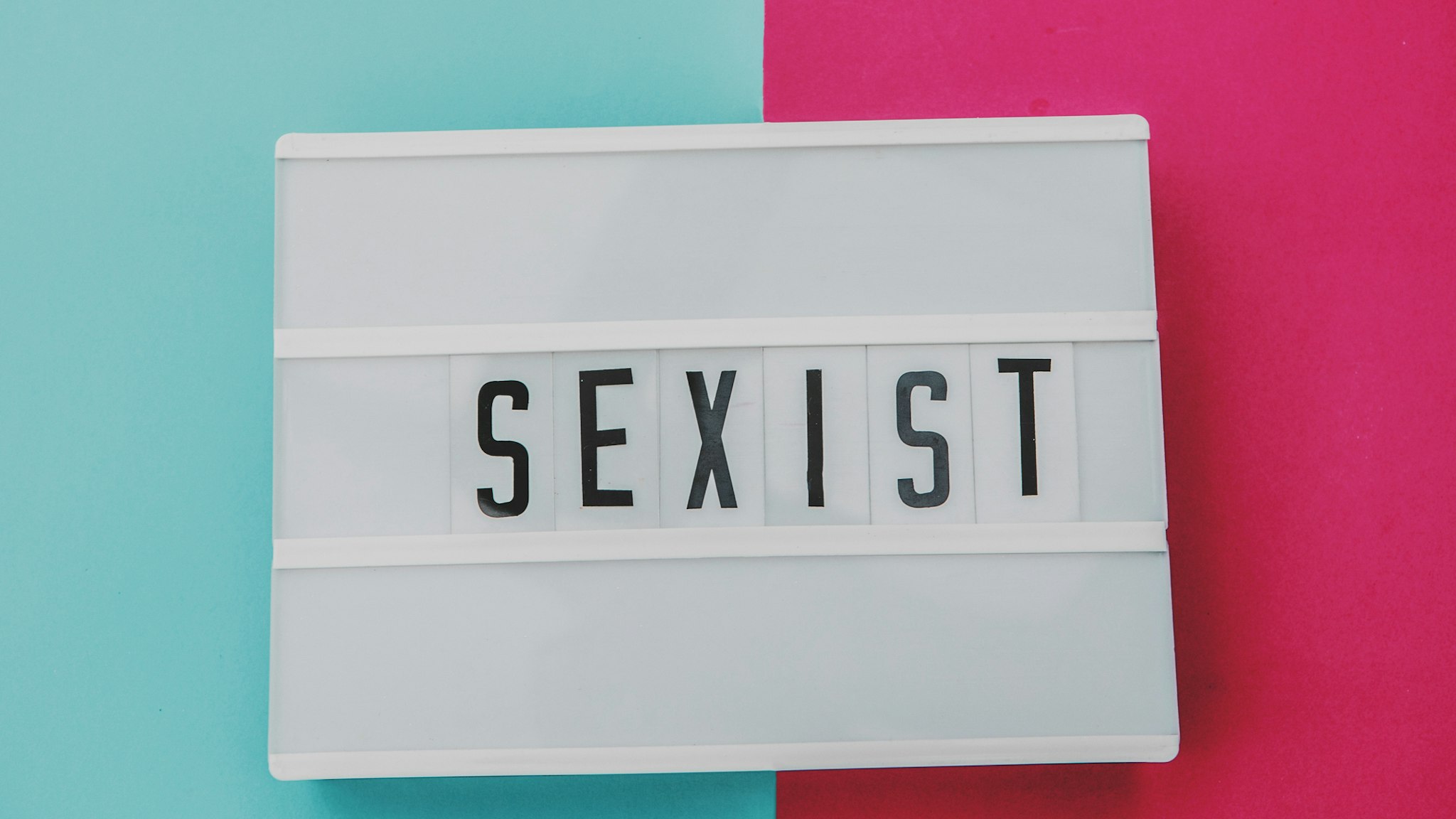 sexist word in pink and blue background