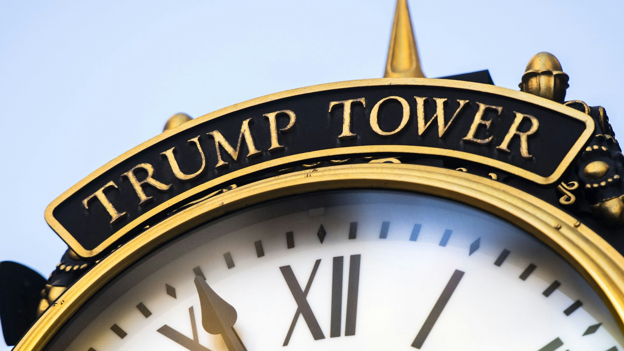 A clock outside of Trump Tower in New York, U.S., on Sunday, Jan. 24, 2021. Donald Trump's name is emblazoned on buildings across Manhattan, usually spelled out in large gold lettering. Now, some unit owners fear that having his name on their building could harm the value of their investment.