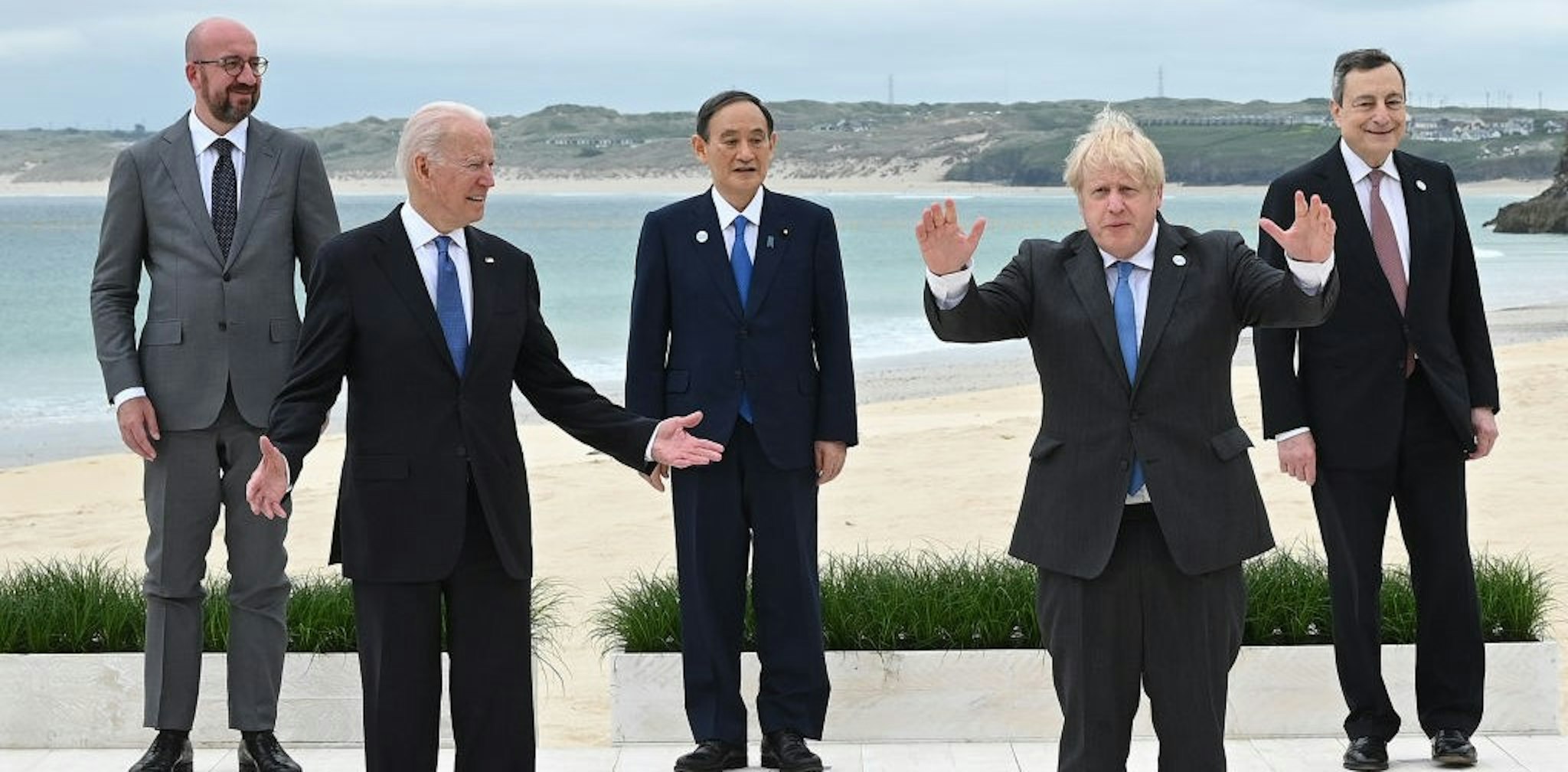 CARBIS BAY, CORNWALL - JUNE 11: (Alternate crop of #1233390711) (L-R) President of the European Council Charles Michel, US President Joe Biden, Japanese Prime Minister Yoshihide Suga, British Prime Minister Boris Johnson and Italian Prime Minister Mario Draghi pose for the Leaders official welcome and family photo during the G7 Summit In Carbis Bay, on June 11, 2021 in Carbis Bay, Cornwall. UK Prime Minister, Boris Johnson, hosts leaders from the USA, Japan, Germany, France, Italy and Canada at the G7 Summit. This year the UK has invited India, South Africa, and South Korea to attend the Leaders' Summit as guest countries as well as the EU. (Photo by