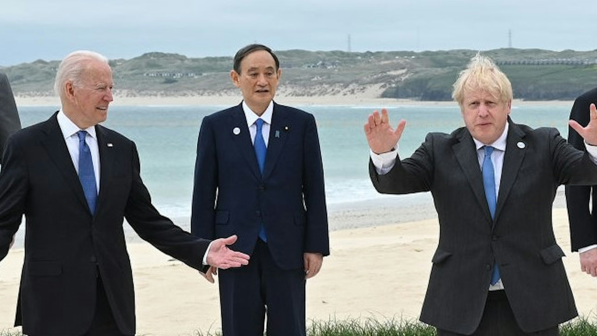CARBIS BAY, CORNWALL - JUNE 11: (Alternate crop of #1233390711) (L-R) President of the European Council Charles Michel, US President Joe Biden, Japanese Prime Minister Yoshihide Suga, British Prime Minister Boris Johnson and Italian Prime Minister Mario Draghi pose for the Leaders official welcome and family photo during the G7 Summit In Carbis Bay, on June 11, 2021 in Carbis Bay, Cornwall. UK Prime Minister, Boris Johnson, hosts leaders from the USA, Japan, Germany, France, Italy and Canada at the G7 Summit. This year the UK has invited India, South Africa, and South Korea to attend the Leaders' Summit as guest countries as well as the EU. (Photo by