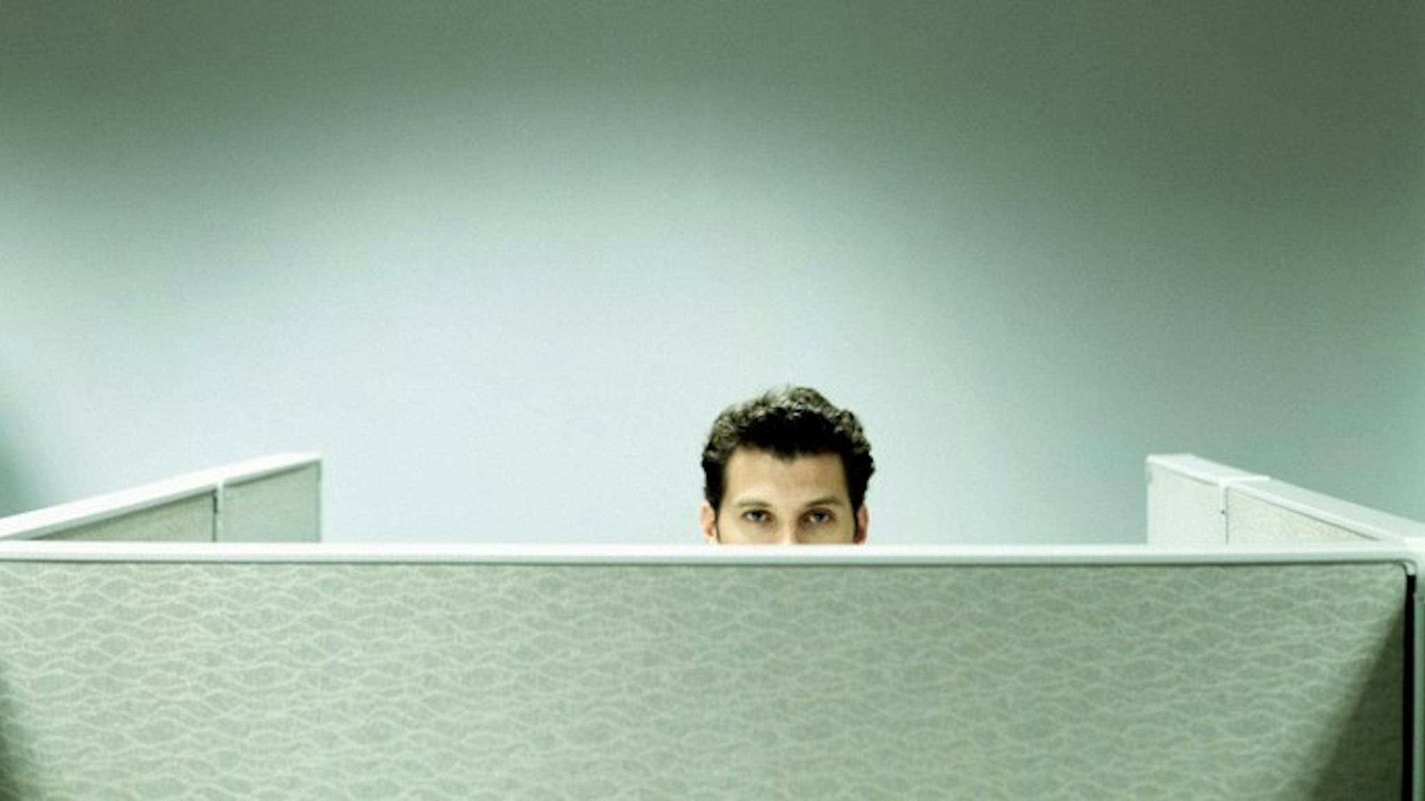 Man Working in Cubicle