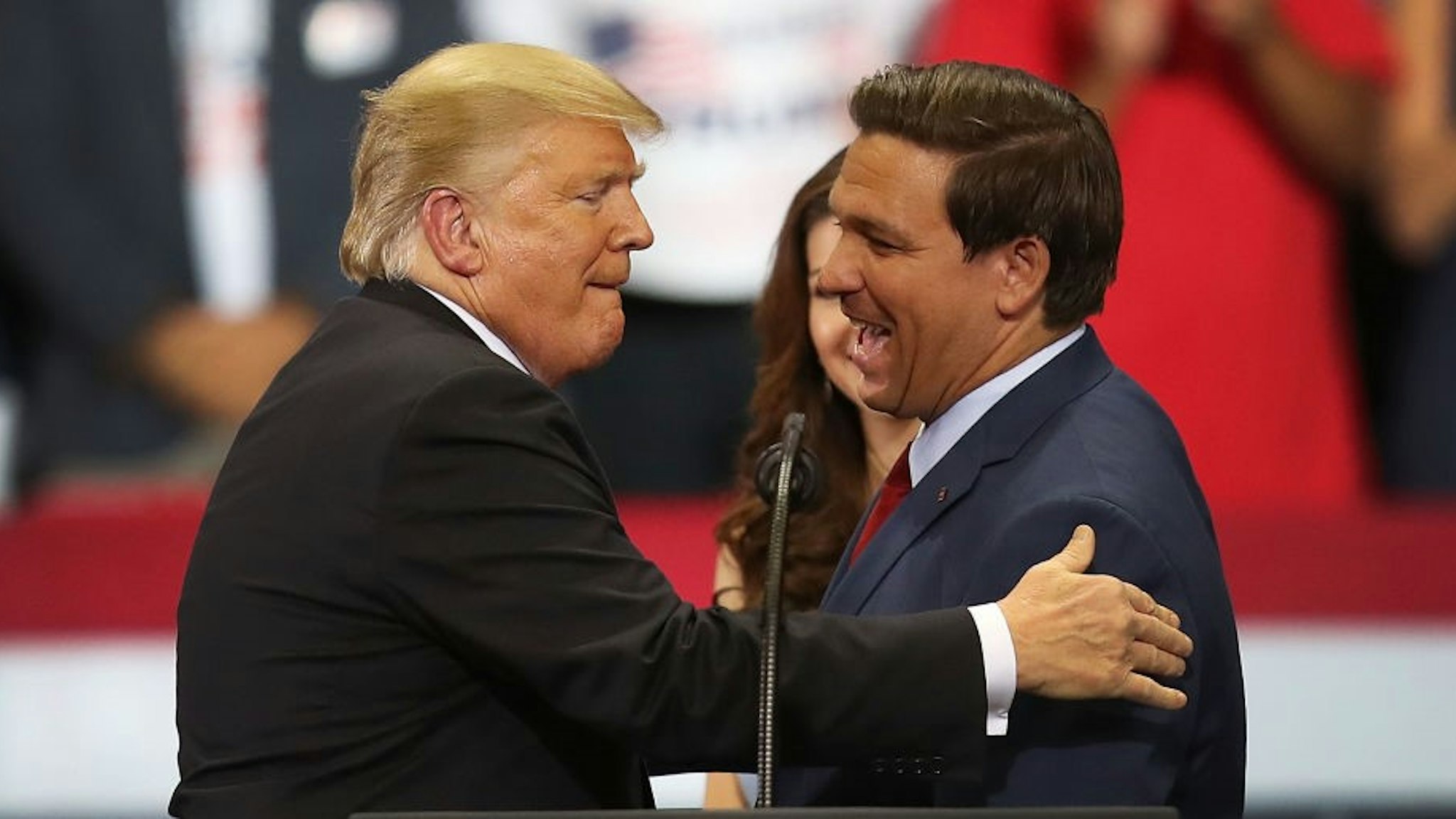 ESTERO, FL - OCTOBER 31: President Donald Trump greets Florida Republican gubernatorial candidate Ron DeSantis during a campaign rally at the Hertz Arena on October 31, 2018 in Estero, Florida. President Trump continues traveling across America to help get the vote out for Republican candidates running for office. (Photo by