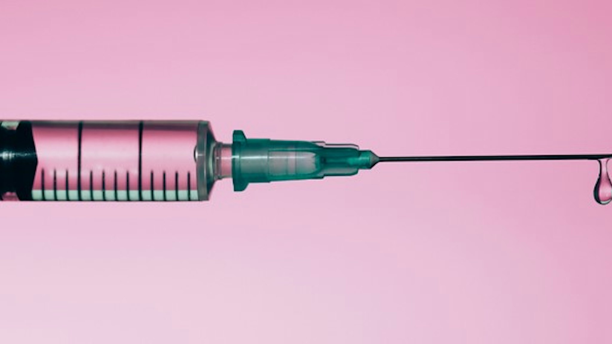 Syringe with drop of medicine
