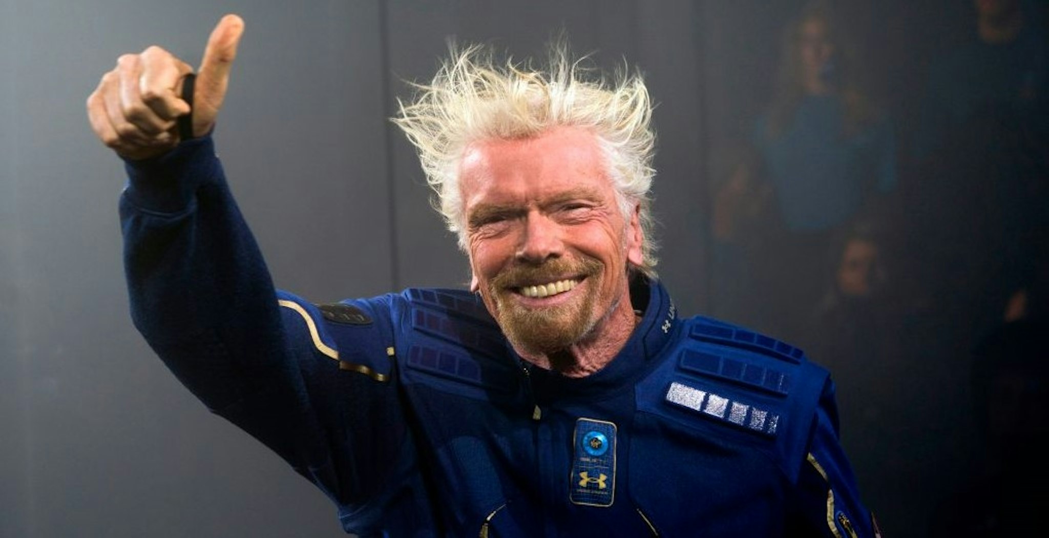 Virgin Galactic Founder Sir Richard Branson demonstrates a spacewear system, designed for Virgin Galactic astronauts, at an event October 16, 2019 in Yonkers, New York. - At the event Virgin Galactic and Under Armour unveiled the worlds first exclusive spacewear system for private astronauts. (Photo by Don Emmert / AFP) (Photo by