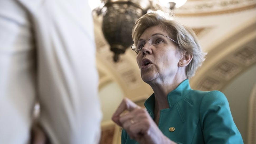 58510E5E-3864-4B49-9BDB-C1F68337BB1B_1_201_a Senate Group Gaining Support For Infrastructure Compromise Senator Elizabeth Warren, a Democrat from Massachusetts, speaks to members of the media outside the Senate chamber during a vote in Washington, D.C., U.S., on Thursday, June 17, 2021. Members of the bipartisan Senate group behind a compromise $579 billion infrastructure plan say more lawmakers are lining up in support, offering a glimmer of hope that it could draw enough votes to pass the Senate. Photographer: Sarah Silbiger/Bloomberg via Getty Images Bloomberg / Contributor via Getty Images