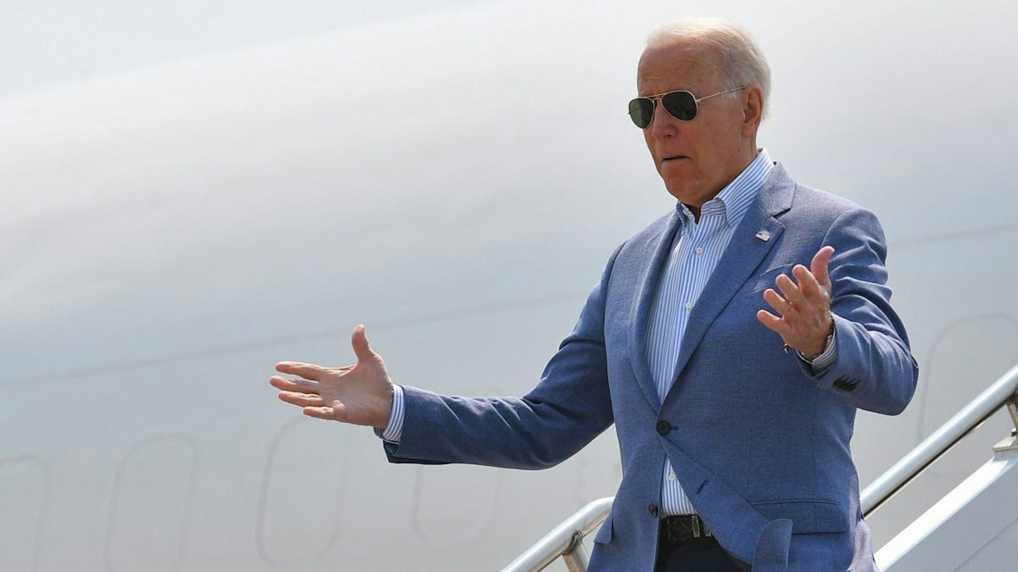 US President Joe Biden steps off Air Force One upon arrival at Cherry Capital Airport in Traverse City, Michigan on July 3, 2021.