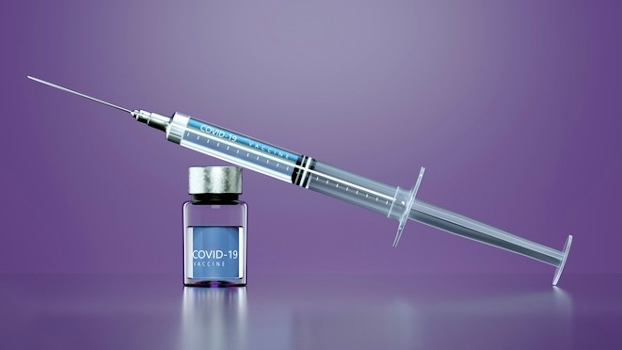 Covid-19 vaccine - stock photo Digital generated image of Syringe with anti COVID-19 vaccine on purple background. Andriy Onufriyenko via Getty Images
