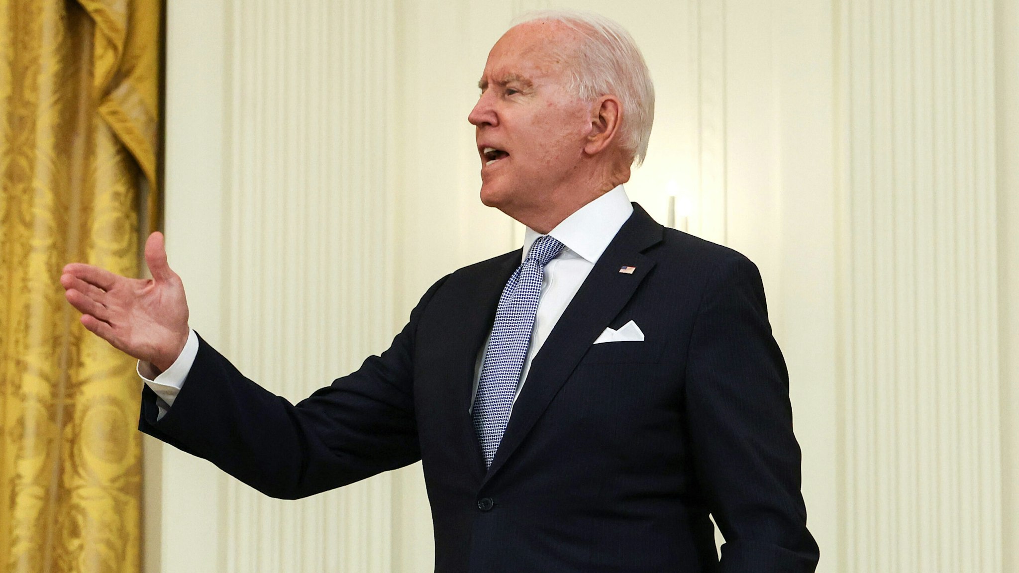 WASHINGTON, DC - JULY 29: U.S. President Joe Biden talks to reporters as he walks off stage after delivering on remarks in the East Room of the White House on July 29, 2021 in Washington, DC. President Biden spoke on his administration's effort to get more Americans vaccinated and plan to combat the spread of the Delta variant.