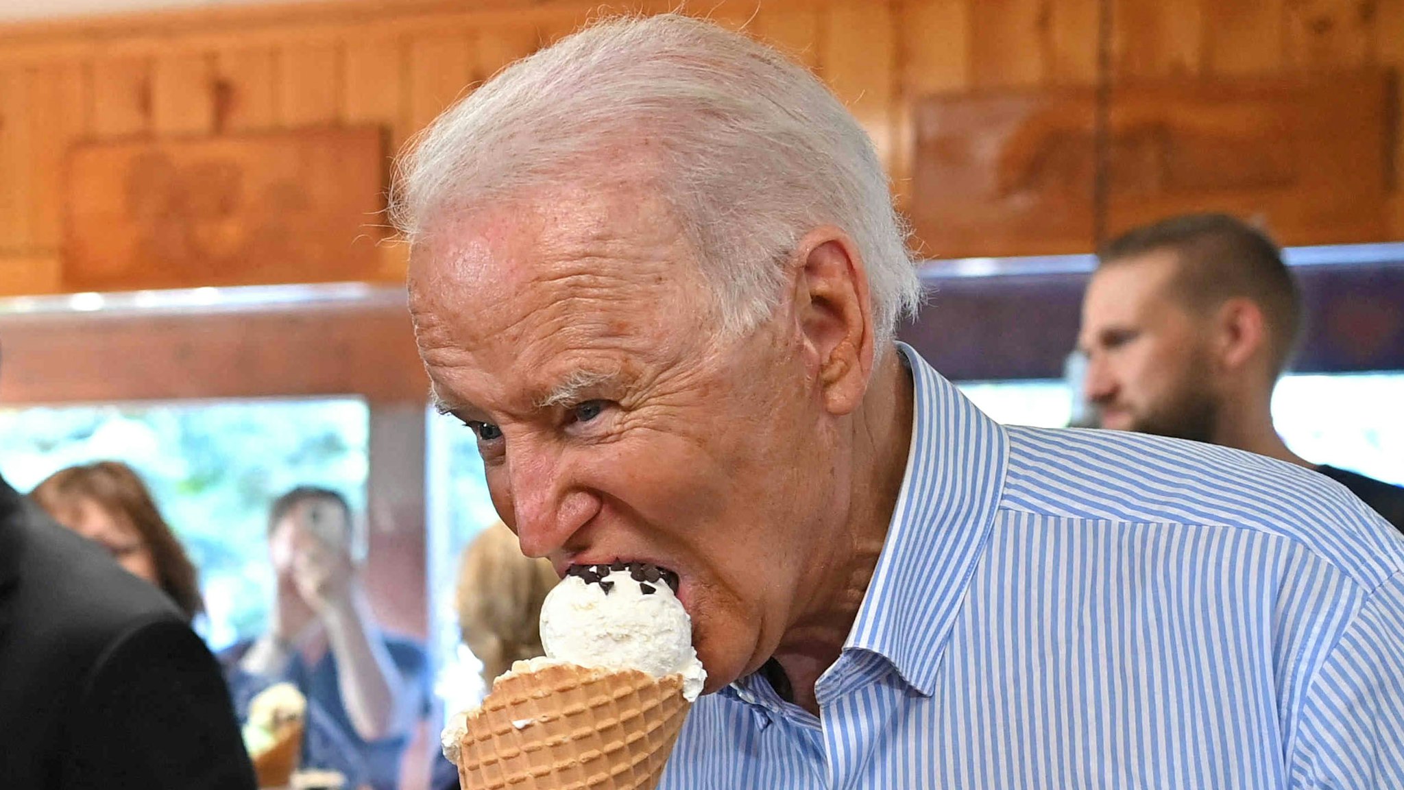 US President Joe Biden eats ice cream at Moomers Homemade Ice Cream in Traverse City, Michigan on July 3, 2021.