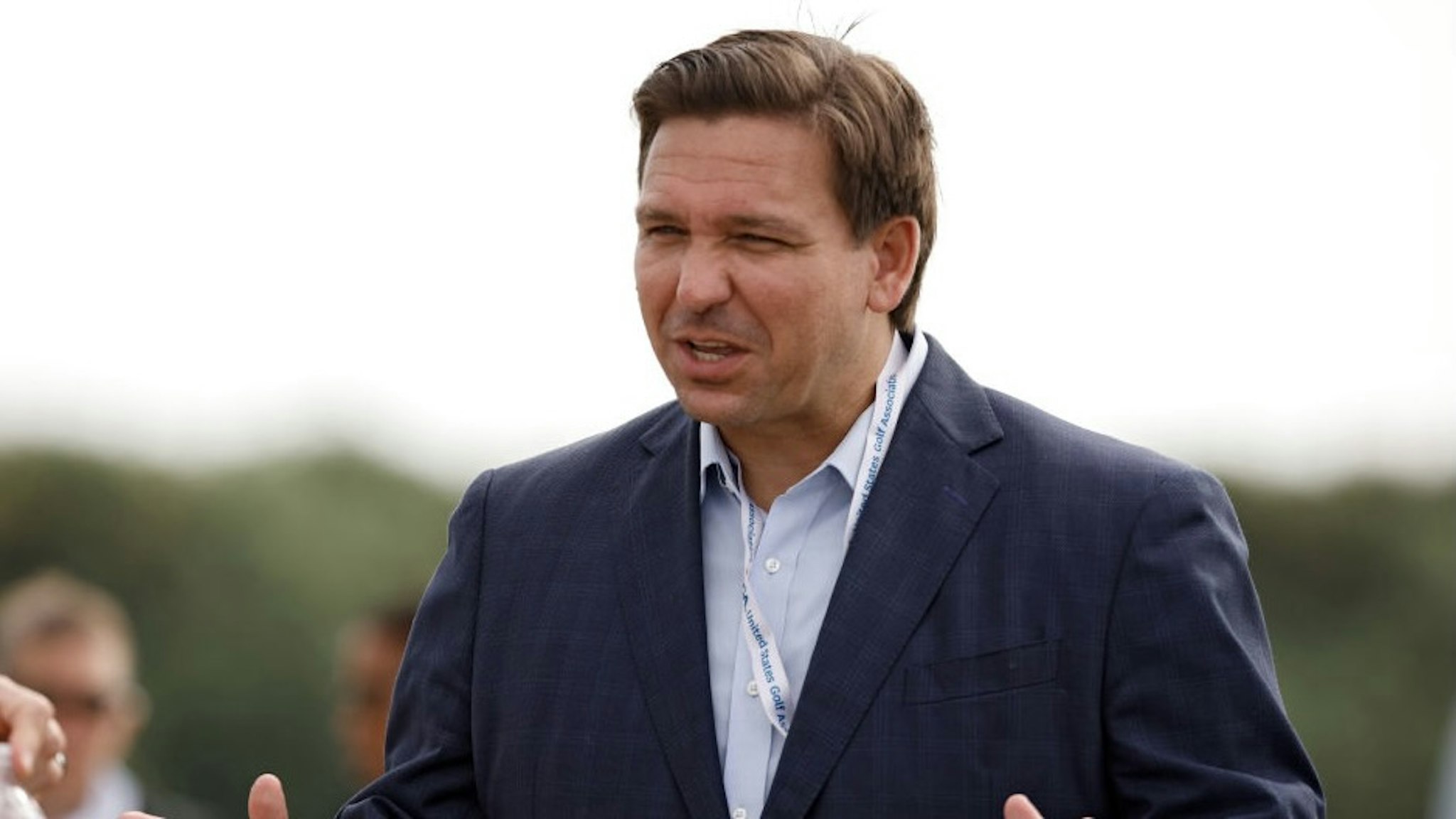 The Walker Cup - Day 1 JUNO BEACH, FLORIDA - MAY 08: Florida governor Ron DeSantis meets with fans during Day One of The Walker Cup at Seminole Golf Club on May 08, 2021 in Juno Beach, Florida. (Photo by Cliff Hawkins/Getty Images) Cliff Hawkins / Staff via Getty Images