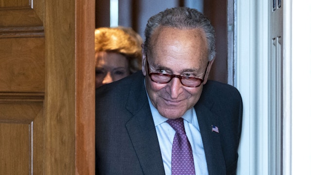 UNITED STATES - JULY 13: Senate Majority Leader Chuck Schumer, D-N.Y., exits the Mansfield Room in the Capitol after the Senate Democrats weekly lunch on Tuesday, July 13, 2021.