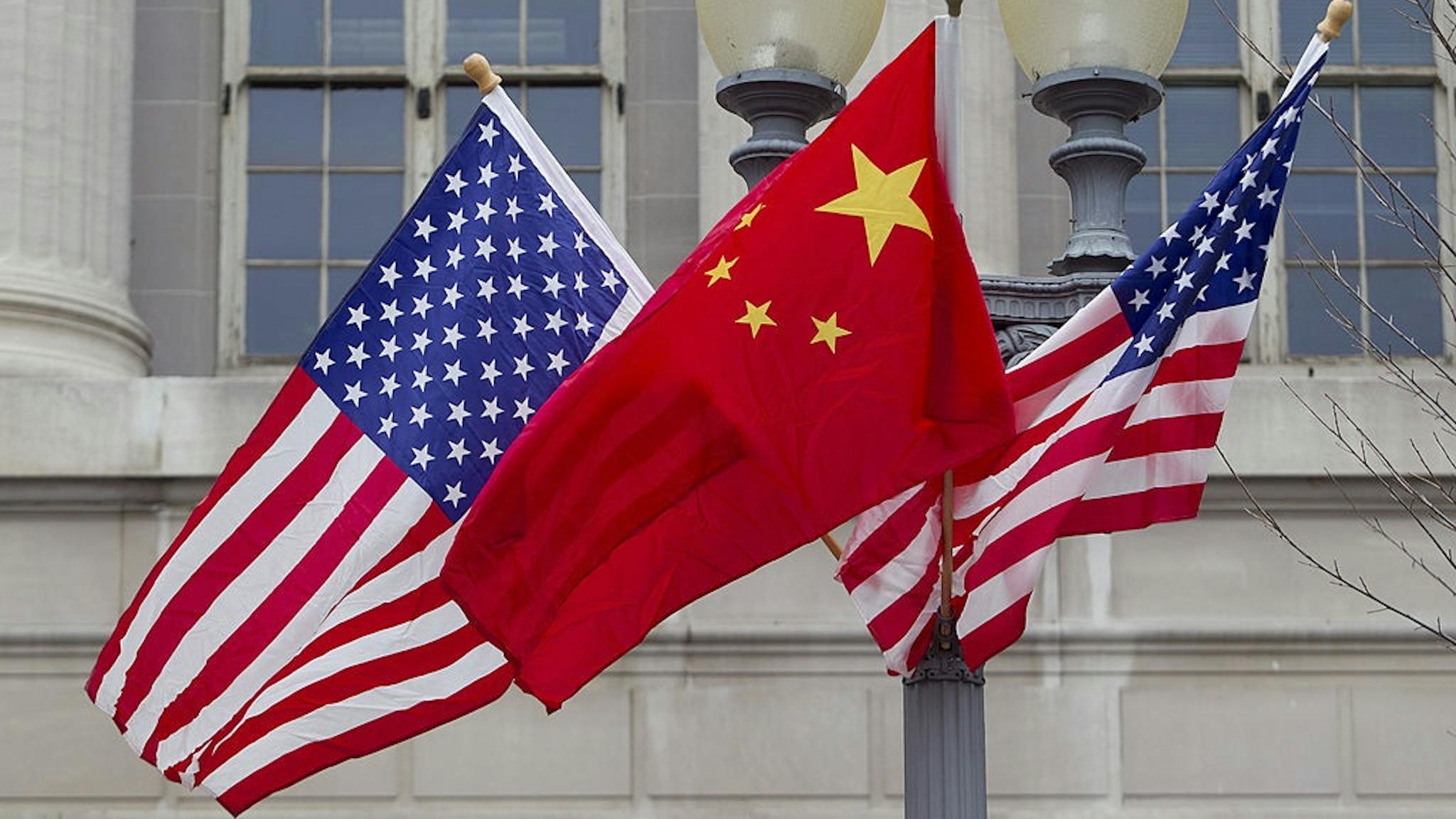 Washington Prepares For Arrival Of Chinese President Hu Jintao Flags of the U.S. and China fly along Pennsylvania Avenue in Washington, D.C., U.S., on Monday, Jan. 17, 2011.