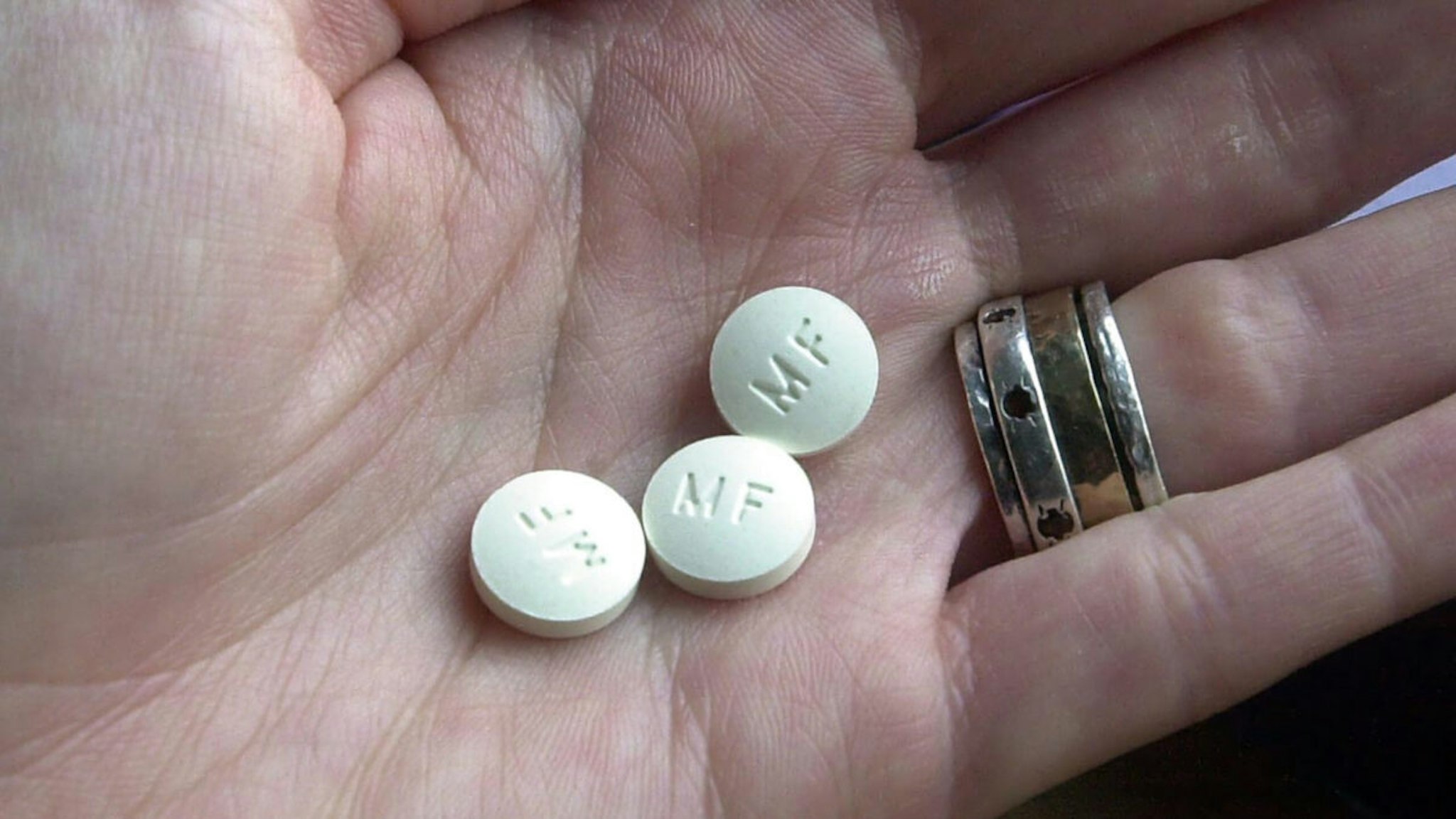 Three RU-486 Mifeprex abortion pills are held in a hand December 1, 2000 in Granite City, Illinois.