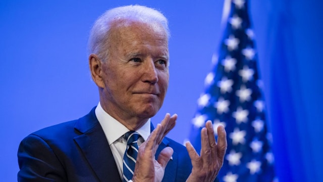 U.S. President Joe Biden applauds as First Lady Jill Biden, not pictured, speaks during the National Education Association's annual meeting and representative assembly event in Washington, D.C., U.S., on Friday, July 2, 2021.