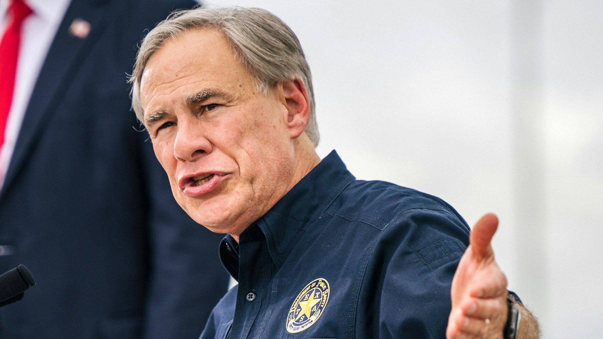PHARR, TEXAS - JUNE 30: Texas Gov. Greg Abbott speaks alongside former President Donald Trump during a tour to an unfinished section of the border wall on June 30, 2021 in Pharr, Texas. Gov. Abbott has pledged to build a state-funded border wall between Texas and Mexico as a surge of mostly Central American immigrants crossing into the United States has challenged U.S. immigration agencies. So far in 2021, U.S. Border Patrol agents have apprehended more than 900,000 immigrants crossing into the United States on the southern border.
