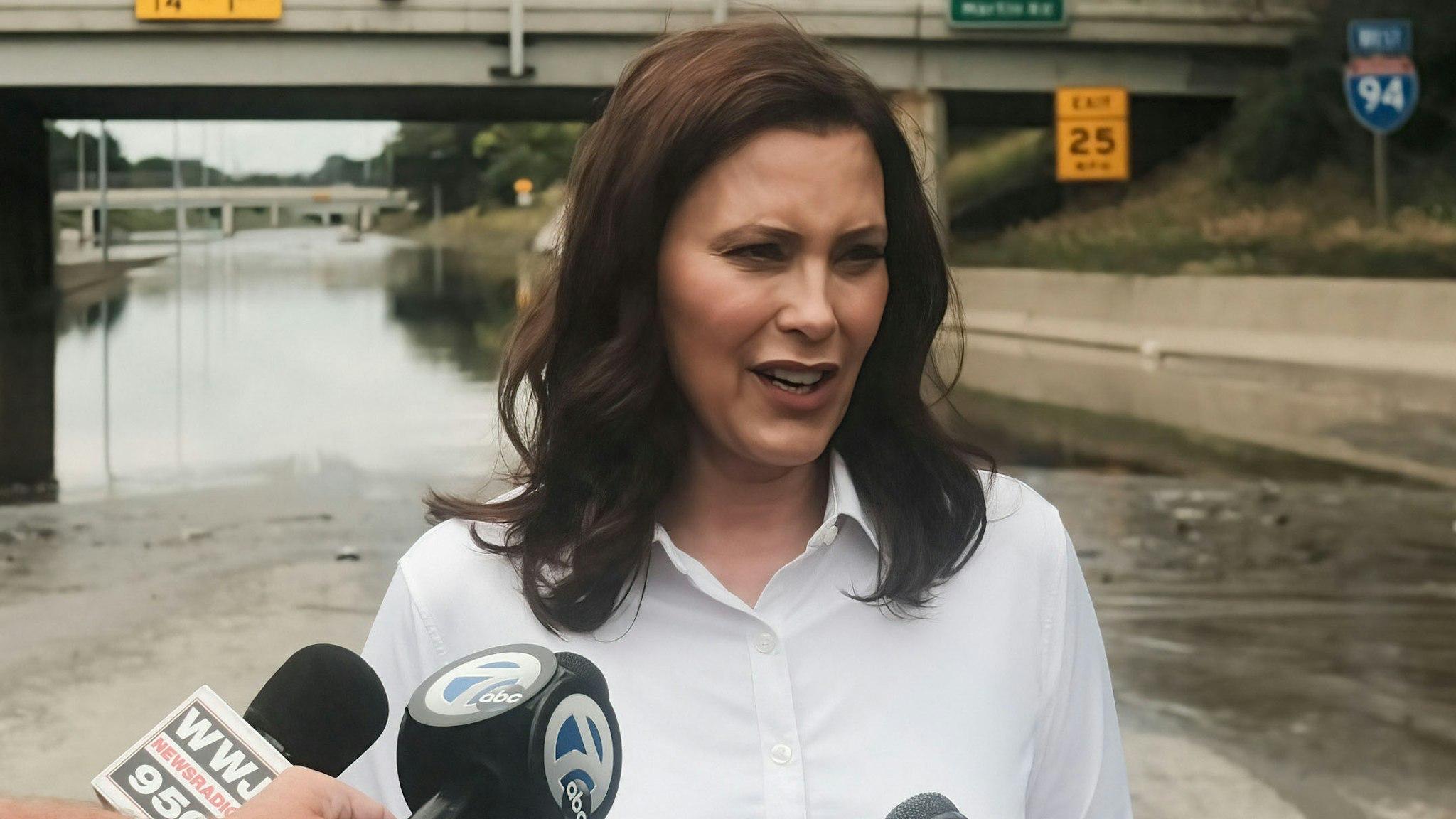 DETROIT, MICHIGAN, UNITED STATES - 2021/06/28: Michigan Governor Gretchen Whitmer speaks to members of the press during a press conference held on the still inundated I-94 in Detroit. After a weekend of heavy storms beginning on Friday night and lasting through the weekend rainwater flooded parts of I-94 in Detroit, Michigan forcing some motorists to abandon their vehicles and seek shelter from the heavy rains. Flood waters remained in areas along I-94 between Dearborn and Downtown Detroit several days later as Michigan Governor Gretchen Whitmer held a press conference on the still inundated I-94.