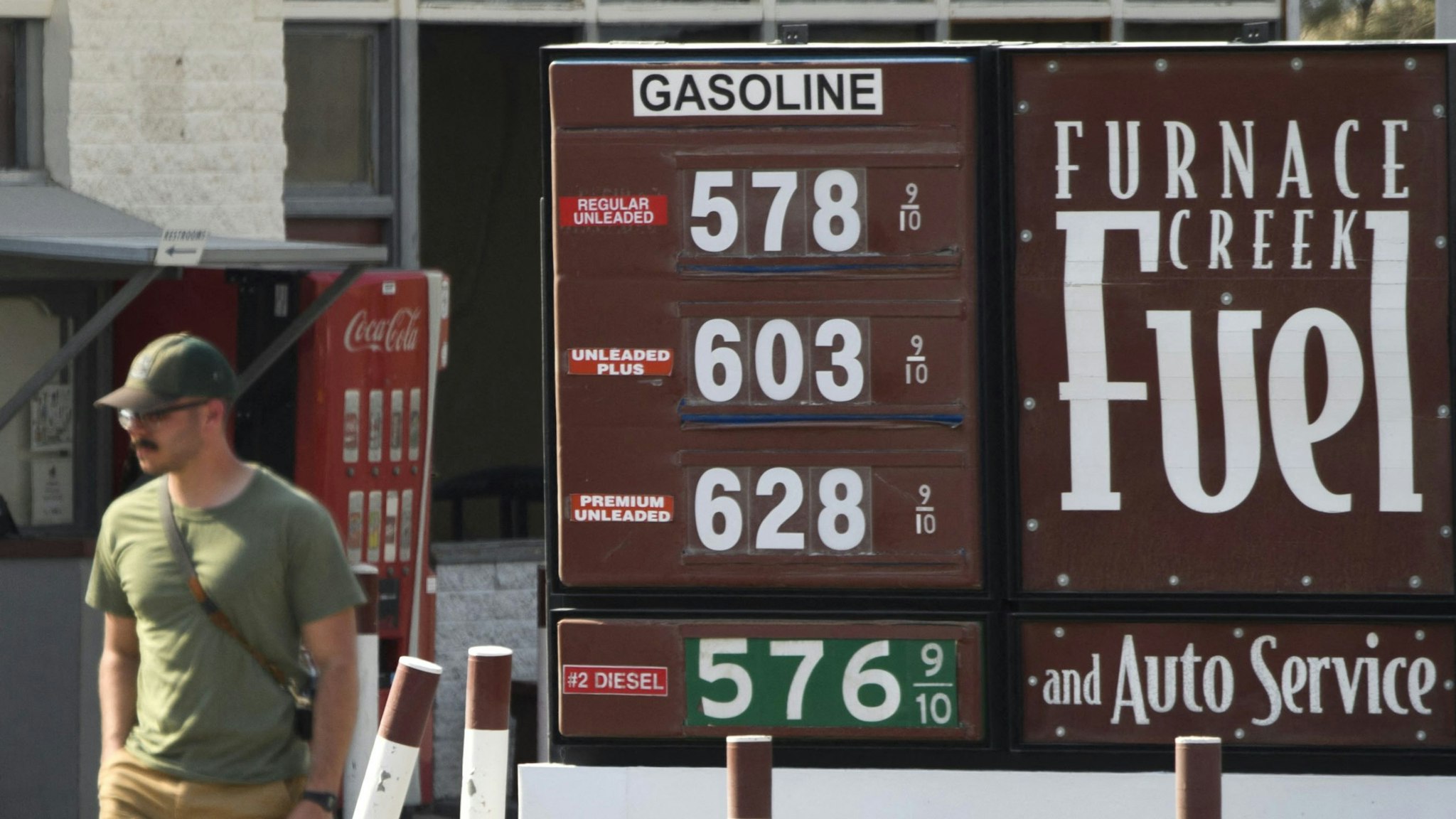 A pedestrian walks past gas station fuel prices above $5 and $6 per gallon at Death Valley National Park in June 17, 2021 in Furnace Creek, California. - Much of the western United States is braced for record heat waves this week, with approximately 50 million Americans placed on alert Tuesday for "excessive" temperatures, which could approach 120 degrees Fahrenheit (50 degrees Celsius) in some areas. The National Park Service warns of extreme summer heat, urging tourists to carry extra water and "travel prepared to survive" in the hottest, lowest, and driest national park featuring steady drought and extreme climates.